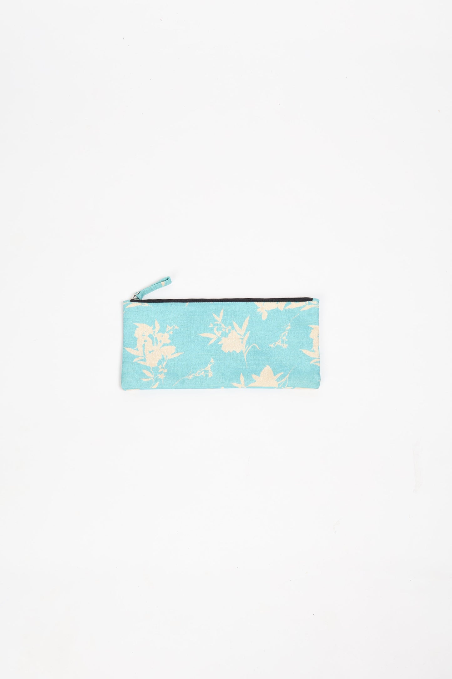 Eco-conscious quilted pencil pouch with waterproof lining made from upcycled garments, reflecting the values of circular fashion, carbon neutral fashion, and repurposed clothing. A perfect example of green fashion and sustainable women's clothing.