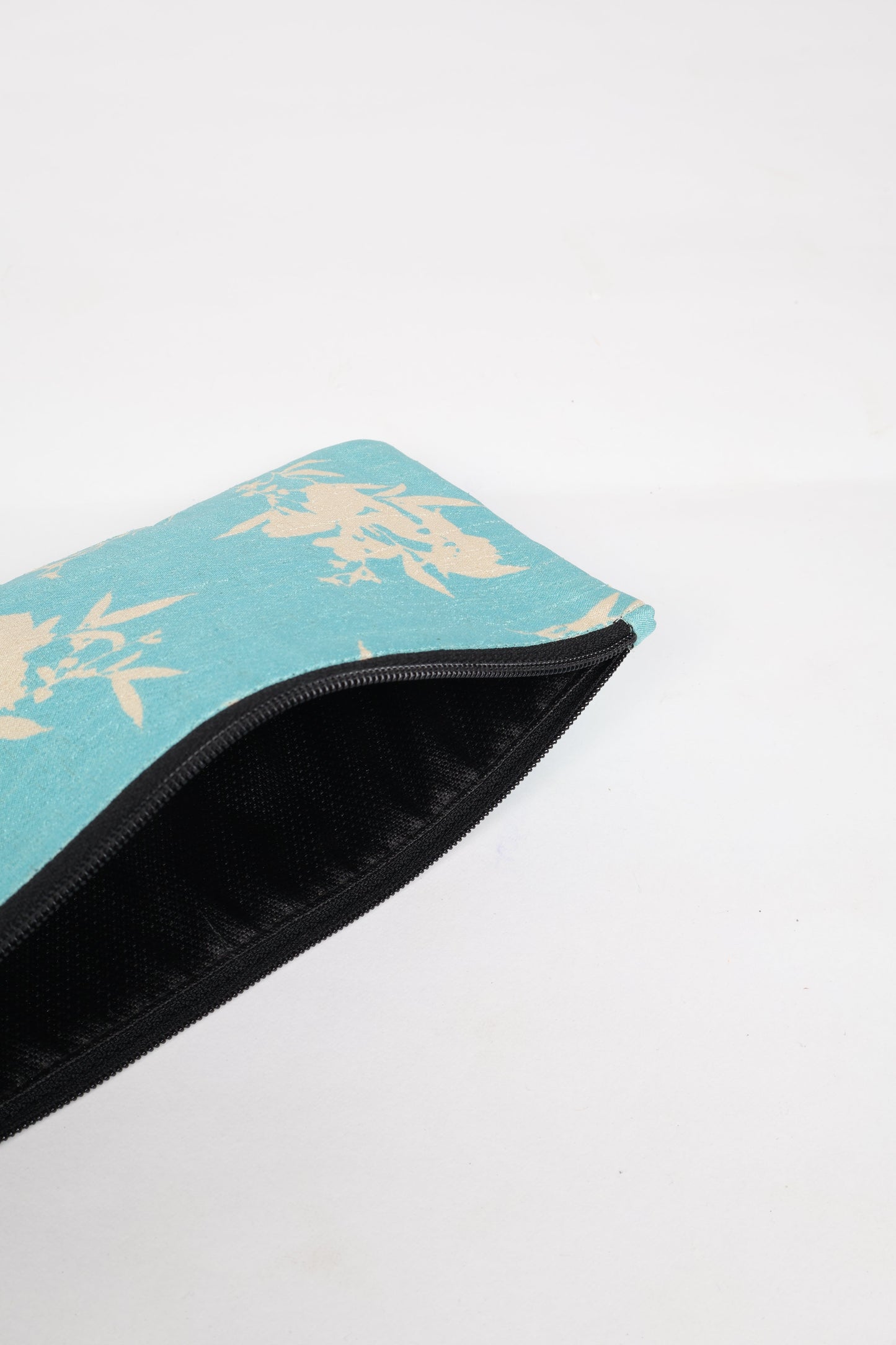 Eco-conscious quilted pencil pouch with waterproof lining made from upcycled garments, reflecting the values of circular fashion, carbon neutral fashion, and repurposed clothing. A perfect example of green fashion and sustainable women's clothing.