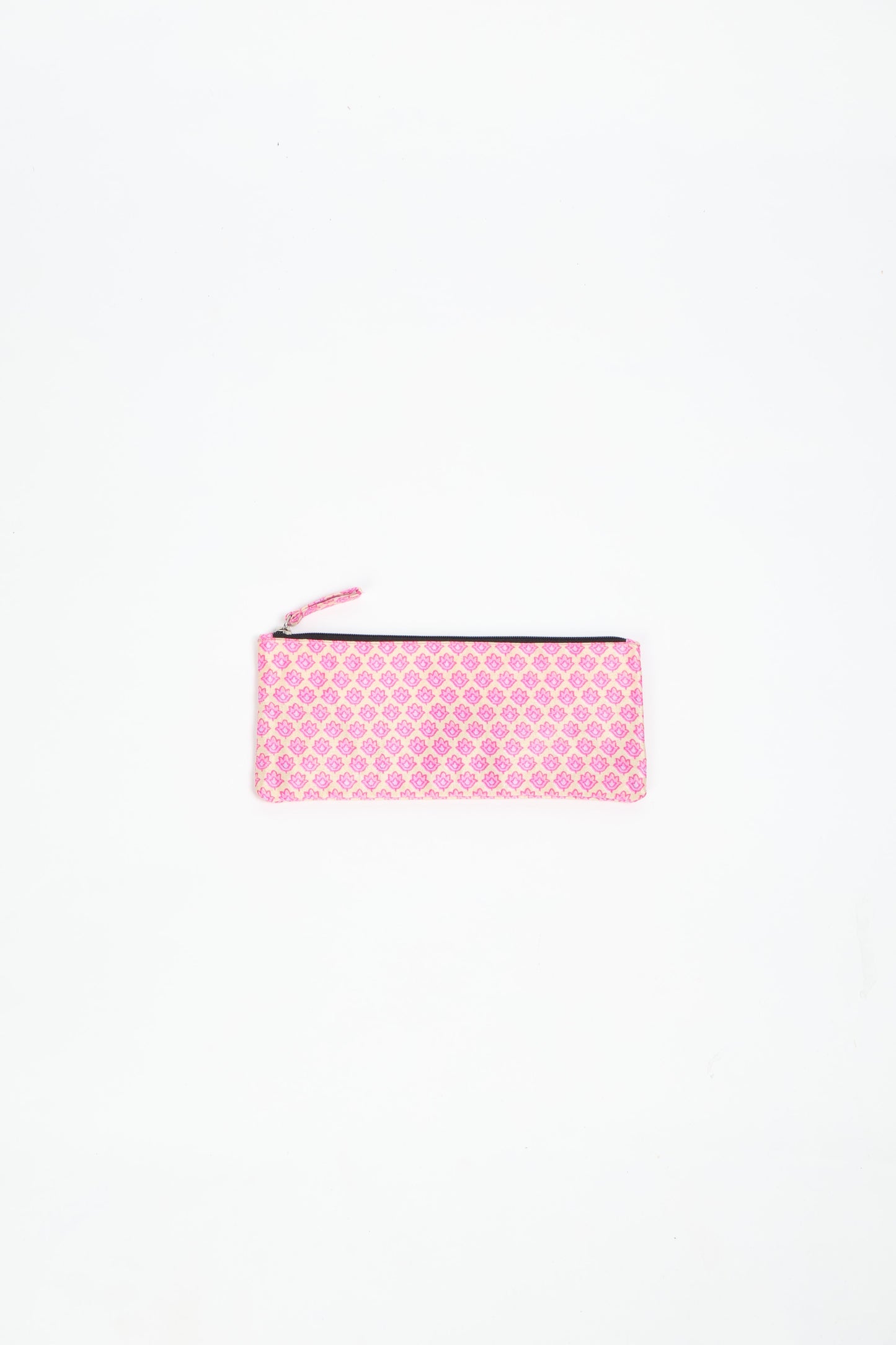 Eco-conscious quilted pencil pouch with waterproof lining made from upcycled garments, reflecting the values of circular fashion, carbon neutral fashion, and repurposed clothing. A perfect example of green fashion and sustainable women's clothing.