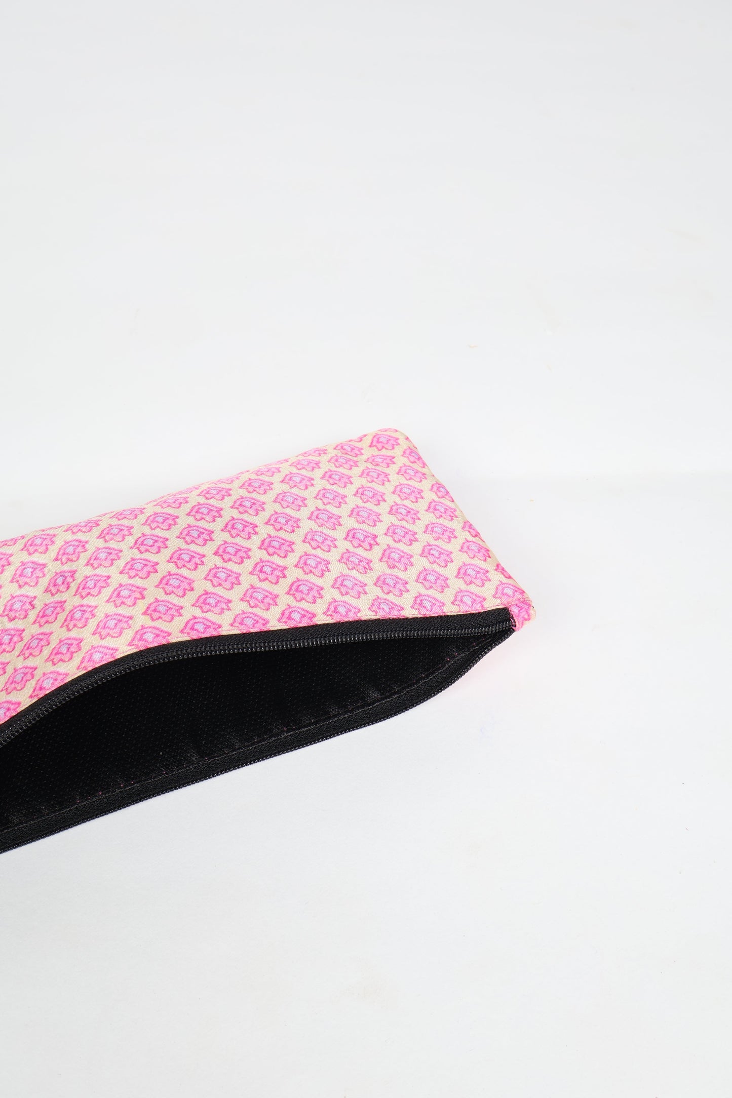 Eco-conscious quilted pencil pouch with waterproof lining made from upcycled garments, reflecting the values of circular fashion, carbon neutral fashion, and repurposed clothing. A perfect example of green fashion and sustainable women's clothing.