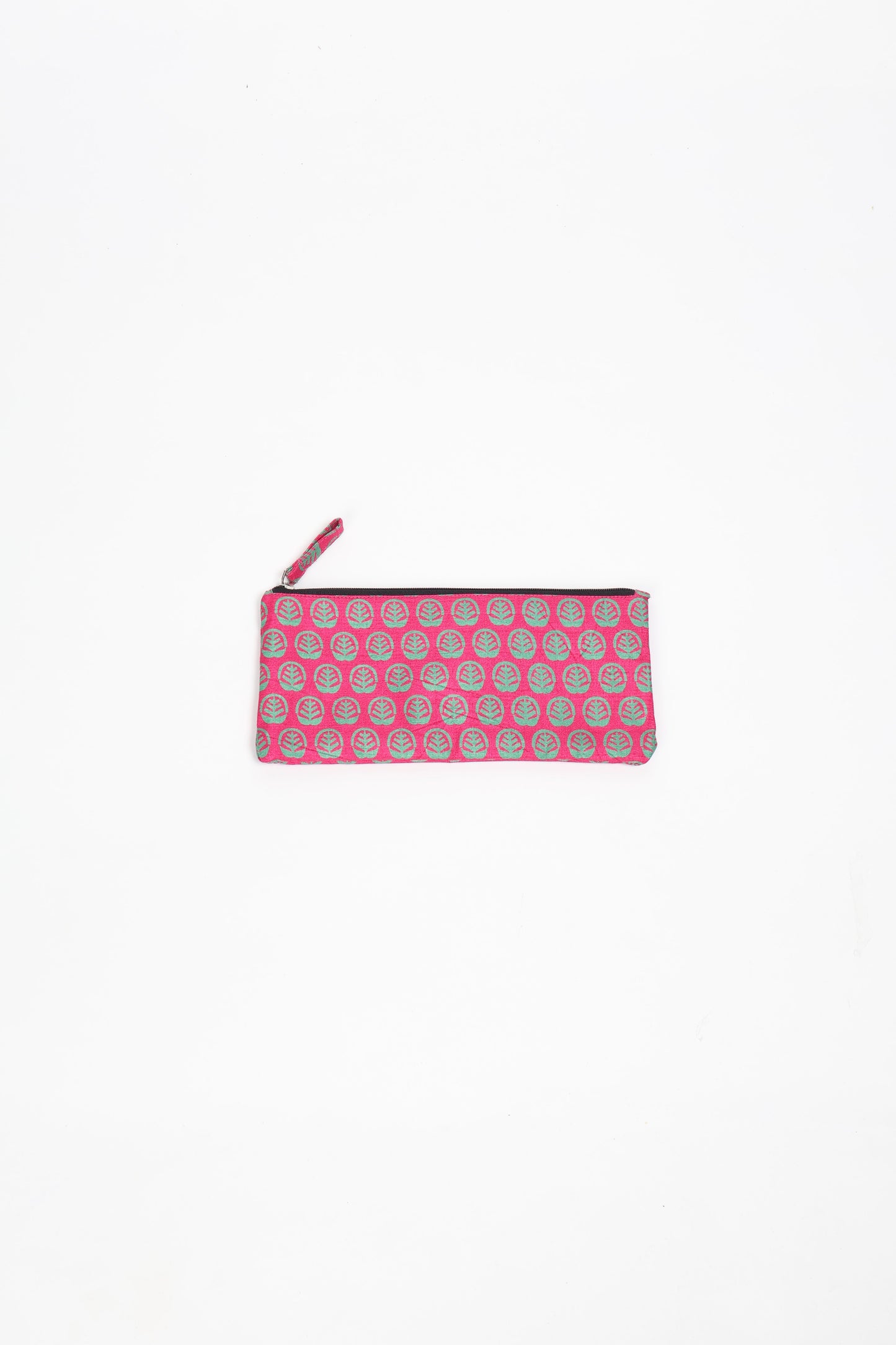 Eco-conscious quilted pencil pouch with waterproof lining made from upcycled garments, reflecting the values of circular fashion, carbon neutral fashion, and repurposed clothing. A perfect example of green fashion and sustainable women's clothing.