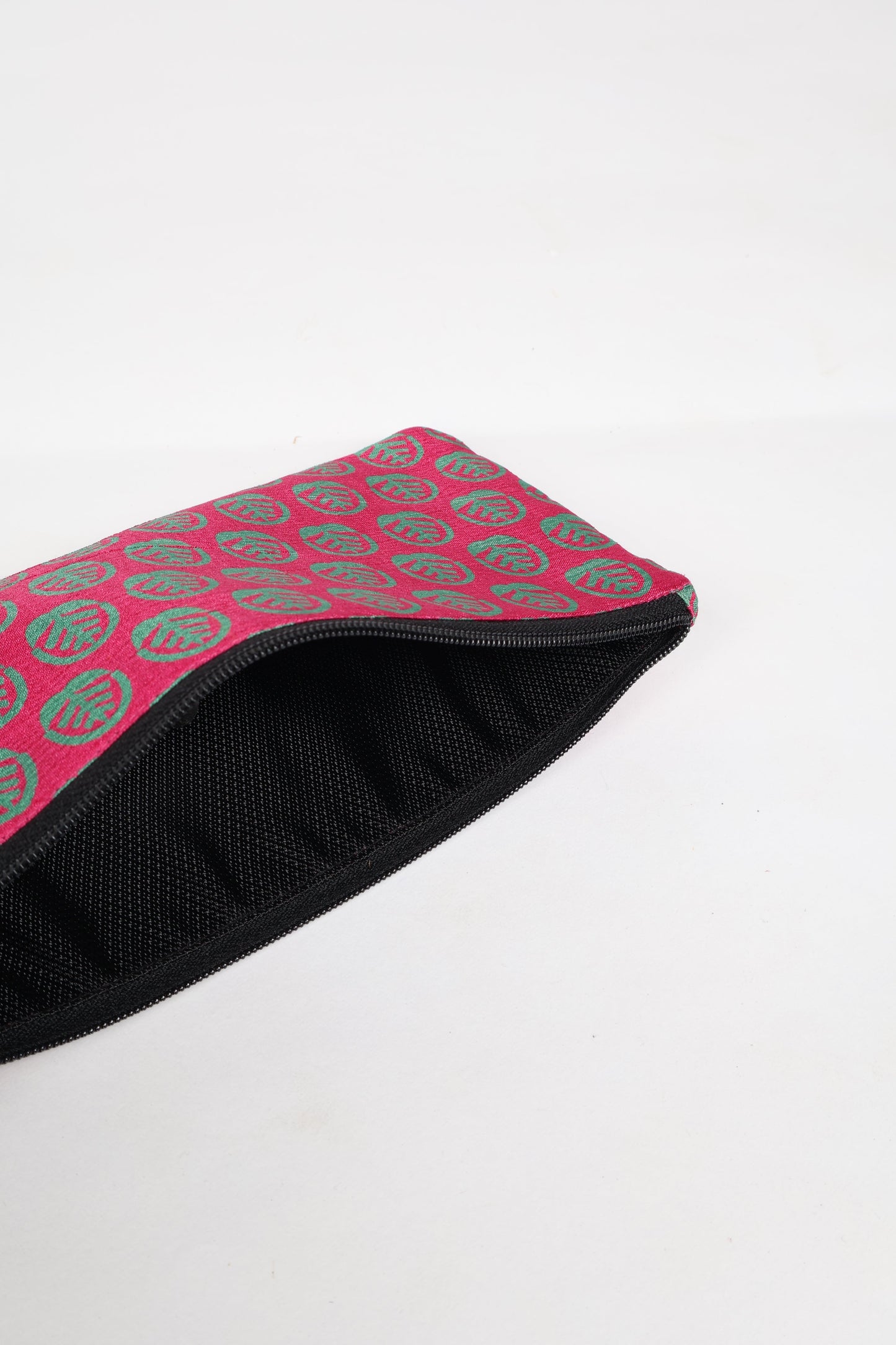 Eco-conscious quilted pencil pouch with waterproof lining made from upcycled garments, reflecting the values of circular fashion, carbon neutral fashion, and repurposed clothing. A perfect example of green fashion and sustainable women's clothing.