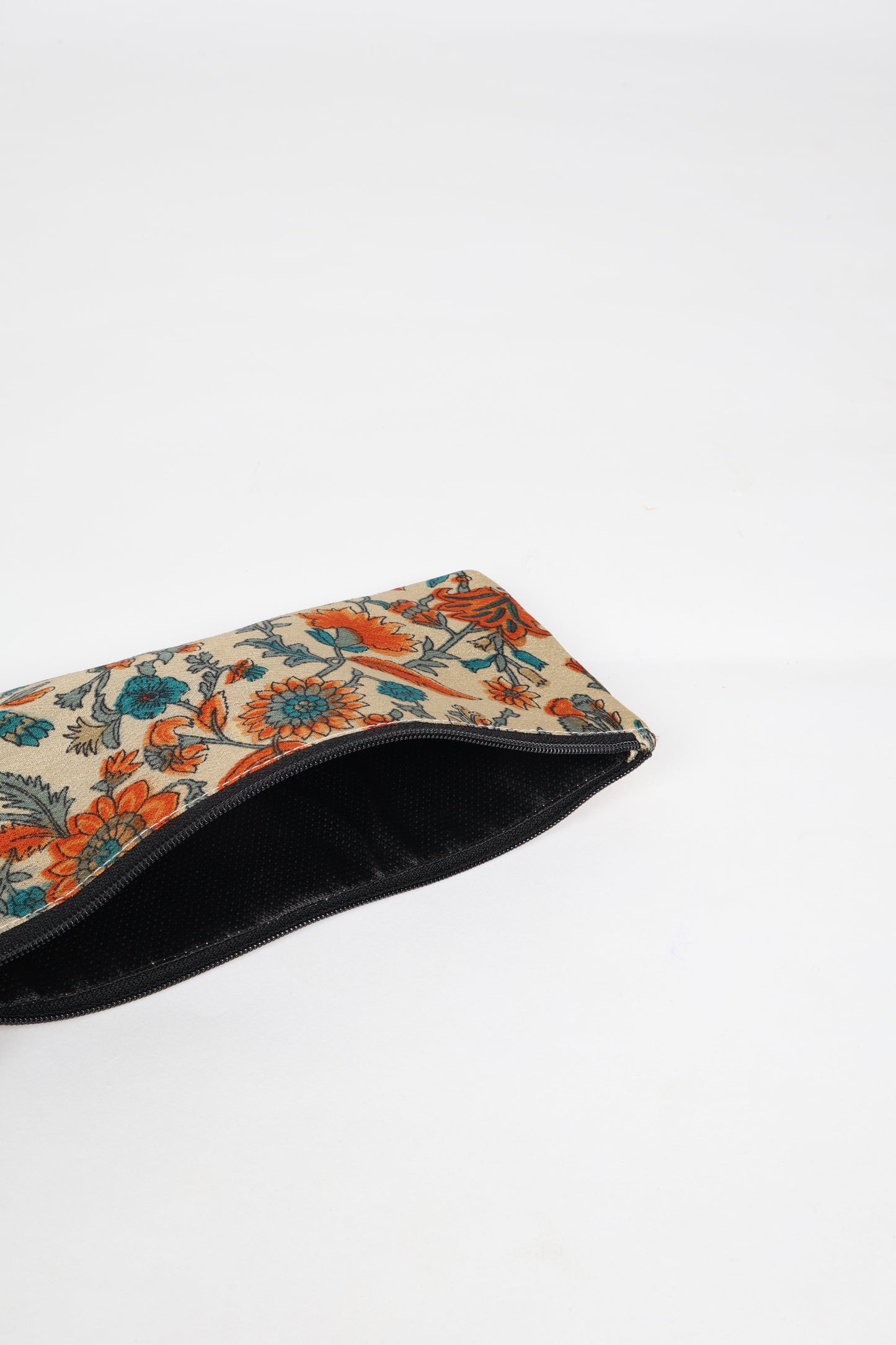 Eco-conscious quilted pencil pouch with waterproof lining made from upcycled garments, reflecting the values of circular fashion, carbon neutral fashion, and repurposed clothing. A perfect example of green fashion and sustainable women's clothing.