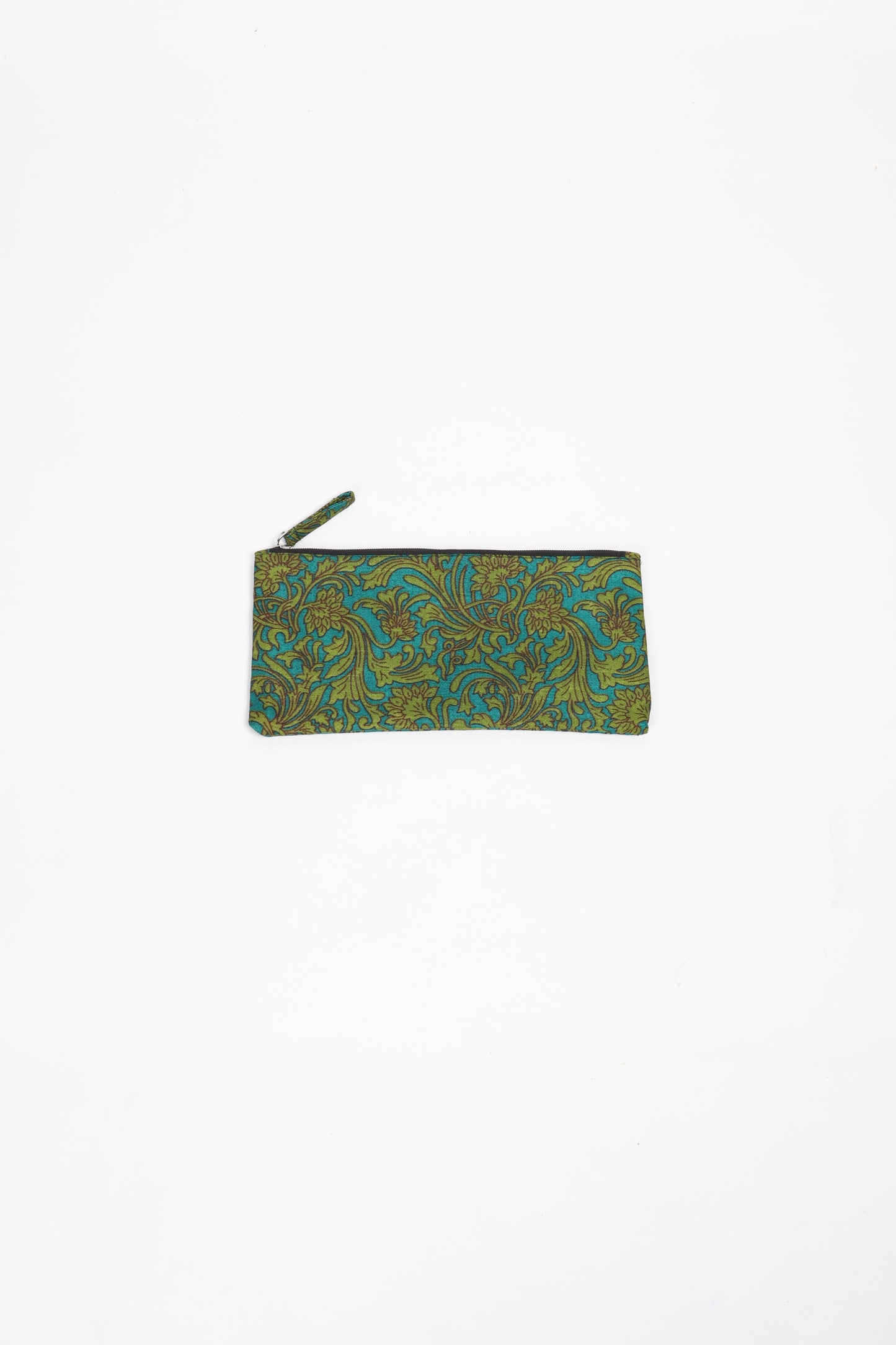 Eco-conscious quilted pencil pouch with waterproof lining made from upcycled garments, reflecting the values of circular fashion, carbon neutral fashion, and repurposed clothing. A perfect example of green fashion and sustainable women's clothing.