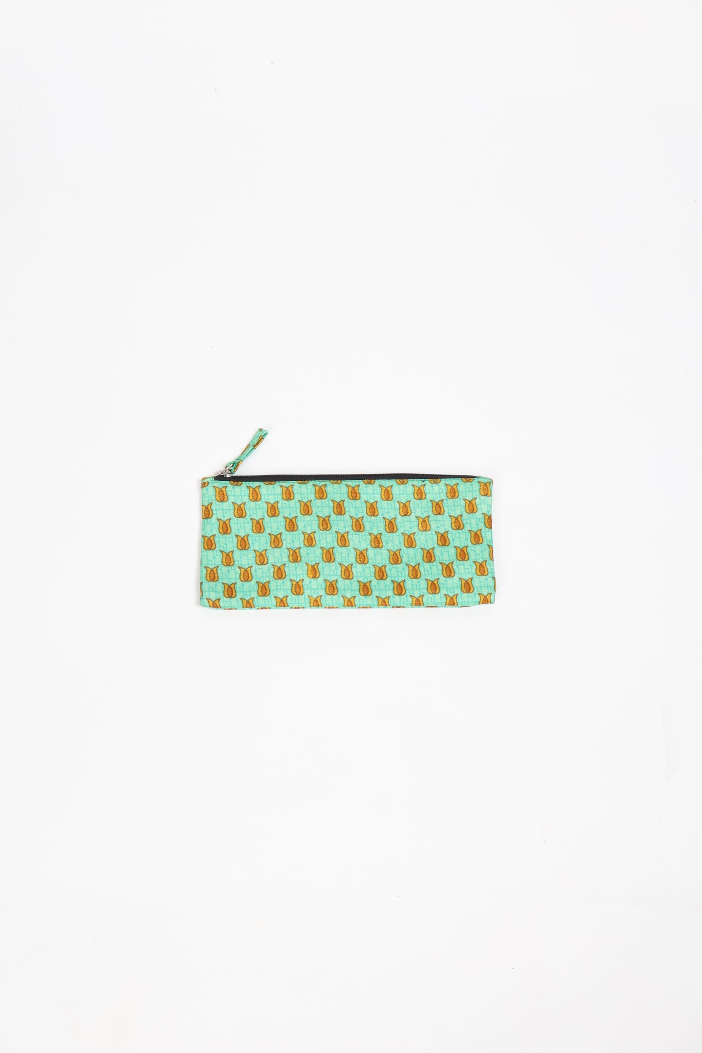 Eco-conscious quilted pencil pouch with waterproof lining made from upcycled garments, reflecting the values of circular fashion, carbon neutral fashion, and repurposed clothing. A perfect example of green fashion and sustainable women's clothing.