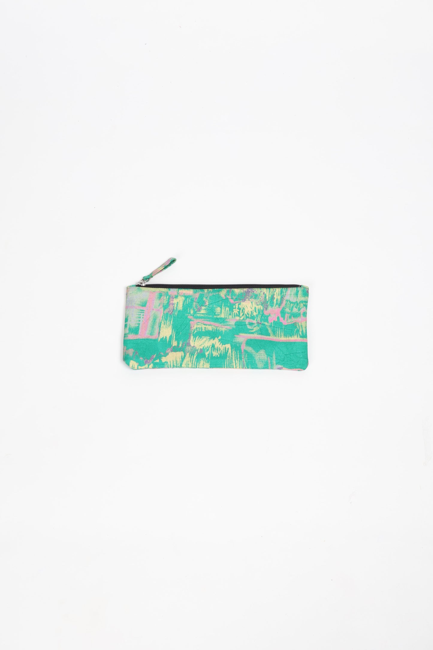 Eco-conscious quilted pencil pouch with waterproof lining made from upcycled garments, reflecting the values of circular fashion, carbon neutral fashion, and repurposed clothing. A perfect example of green fashion and sustainable women's clothing.