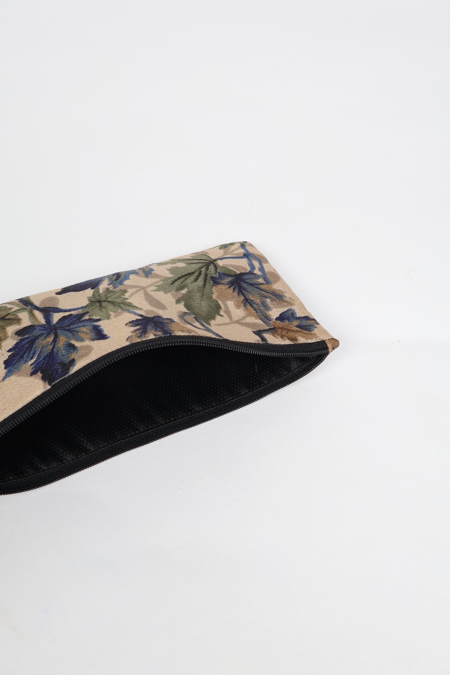 Eco-conscious quilted pencil pouch with waterproof lining made from upcycled garments, reflecting the values of circular fashion, carbon neutral fashion, and repurposed clothing. A perfect example of green fashion and sustainable women's clothing.