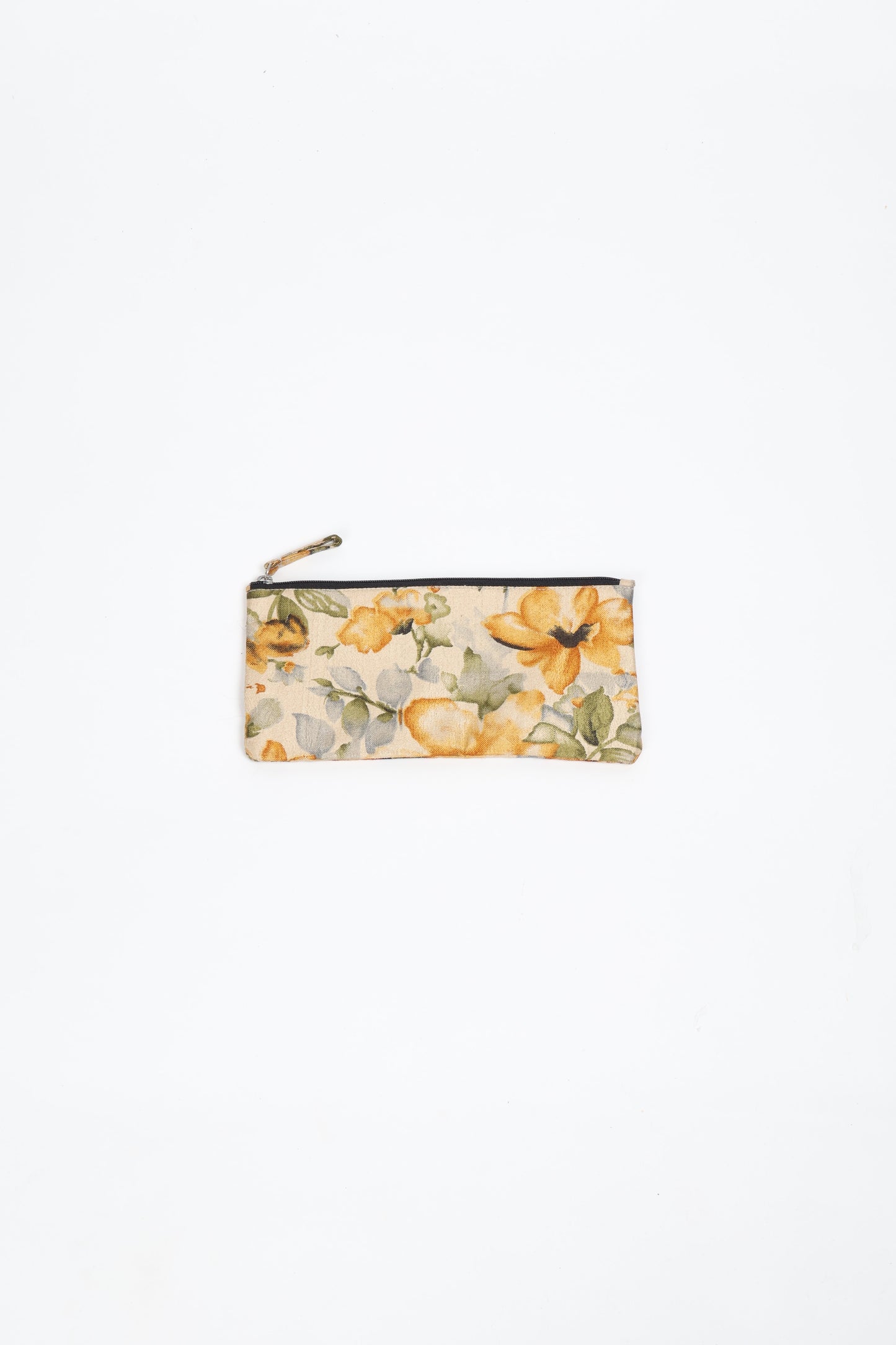 Eco-conscious quilted pencil pouch with waterproof lining made from upcycled garments, reflecting the values of circular fashion, carbon neutral fashion, and repurposed clothing. A perfect example of green fashion and sustainable women's clothing.