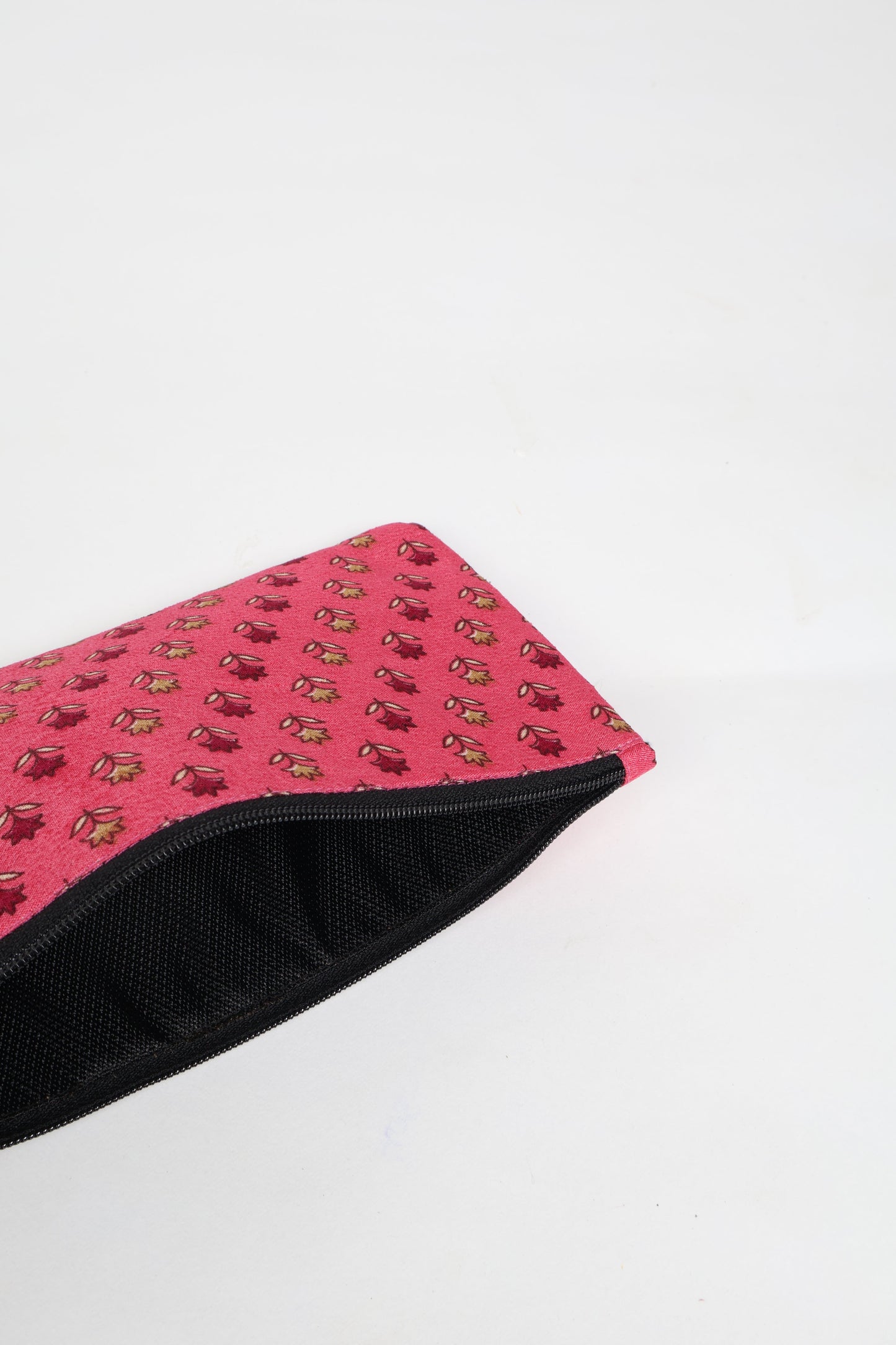 Eco-conscious quilted pencil pouch with waterproof lining made from upcycled garments, reflecting the values of circular fashion, carbon neutral fashion, and repurposed clothing. A perfect example of green fashion and sustainable women's clothing.
