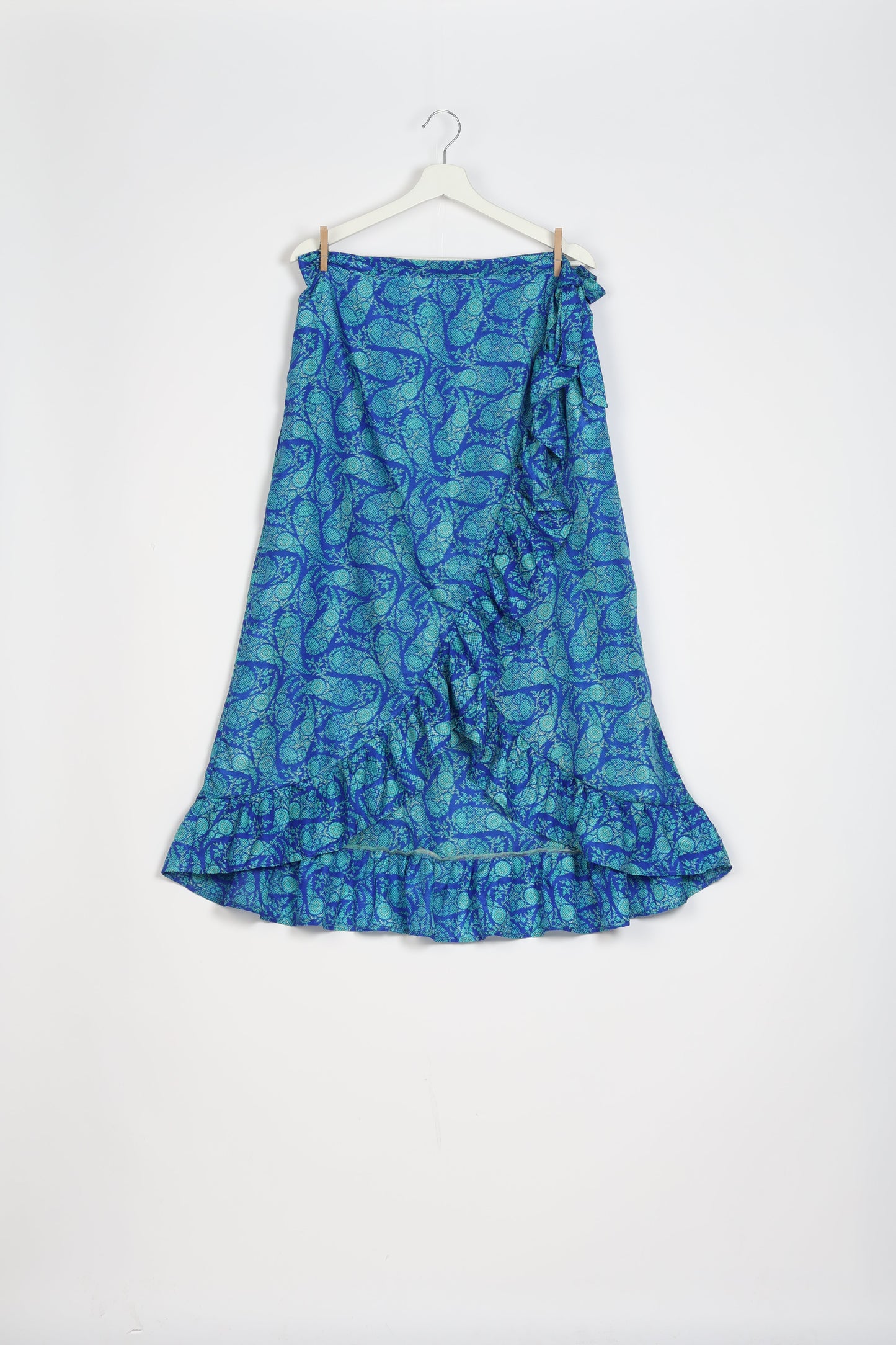 Frill Skirt Set made from recycled materials, highlighting sustainable fashion and fair trade practices. Features a ruffled wraparound skirt and a string-back top, symbolizing upcycled women's clothing and eco-friendly fashion.