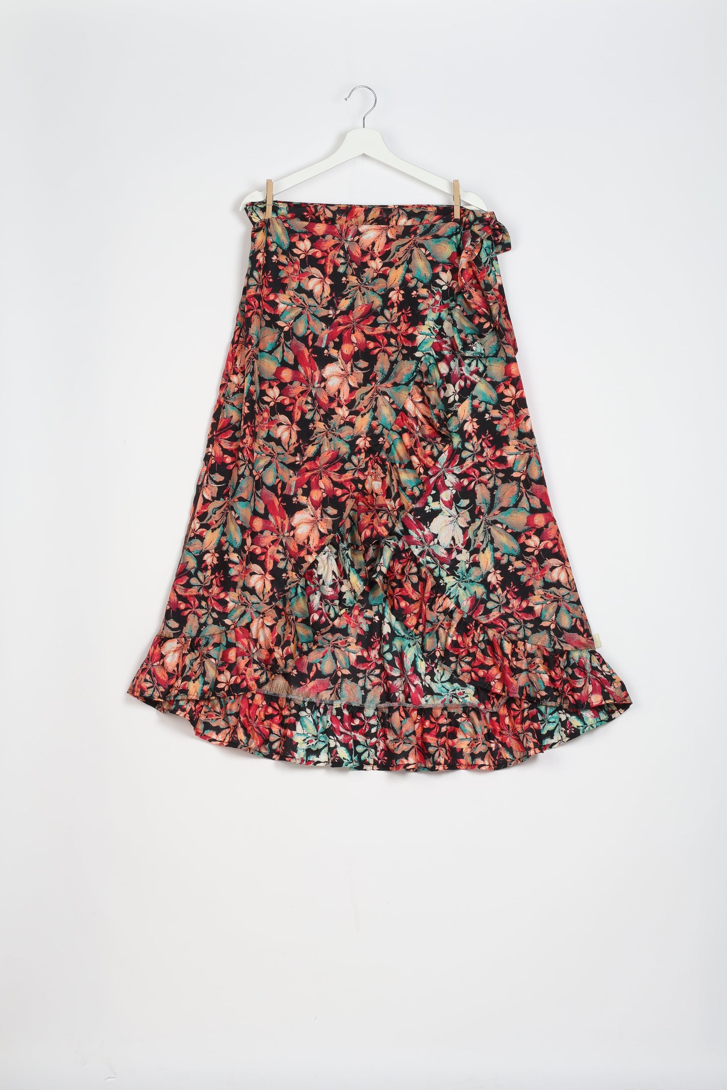 Frill Skirt Set made from recycled materials, highlighting sustainable fashion and fair trade practices. Features a ruffled wraparound skirt and a string-back top, symbolizing upcycled women's clothing and eco-friendly fashion.