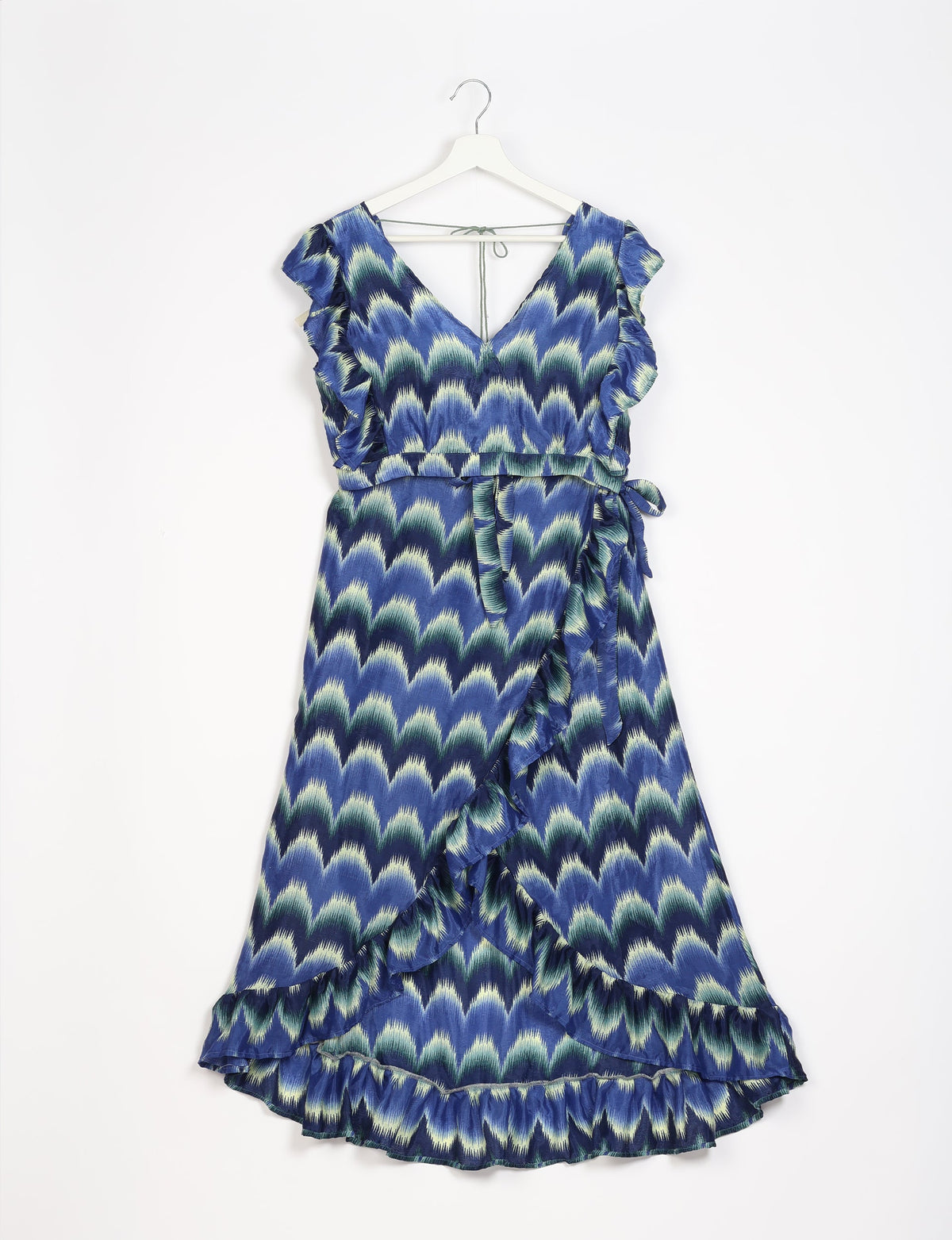Blue and green ikat patterned frill skirt set with V-neck, ruffle sleeves, wrap style, and tie belt on white hanger