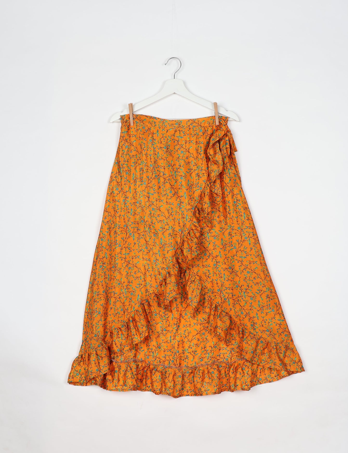 Frill Skirt Set made from recycled materials, highlighting sustainable fashion and fair trade practices. Features a ruffled wraparound skirt and a string-back top, symbolizing upcycled women's clothing and eco-friendly fashion.