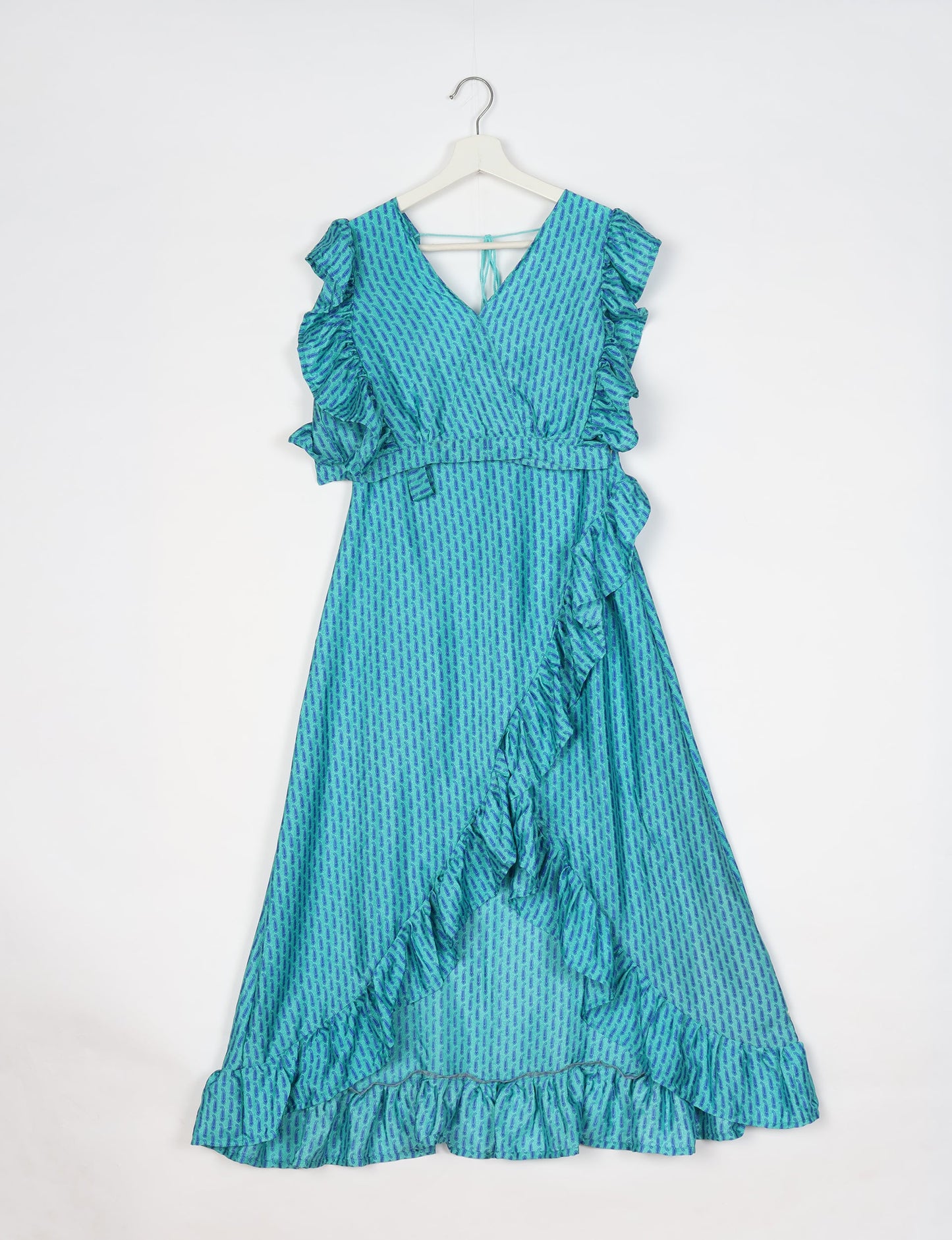 Frill Skirt Set made from recycled materials, highlighting sustainable fashion and fair trade practices. Features a ruffled wraparound skirt and a string-back top, symbolizing upcycled women's clothing and eco-friendly fashion.