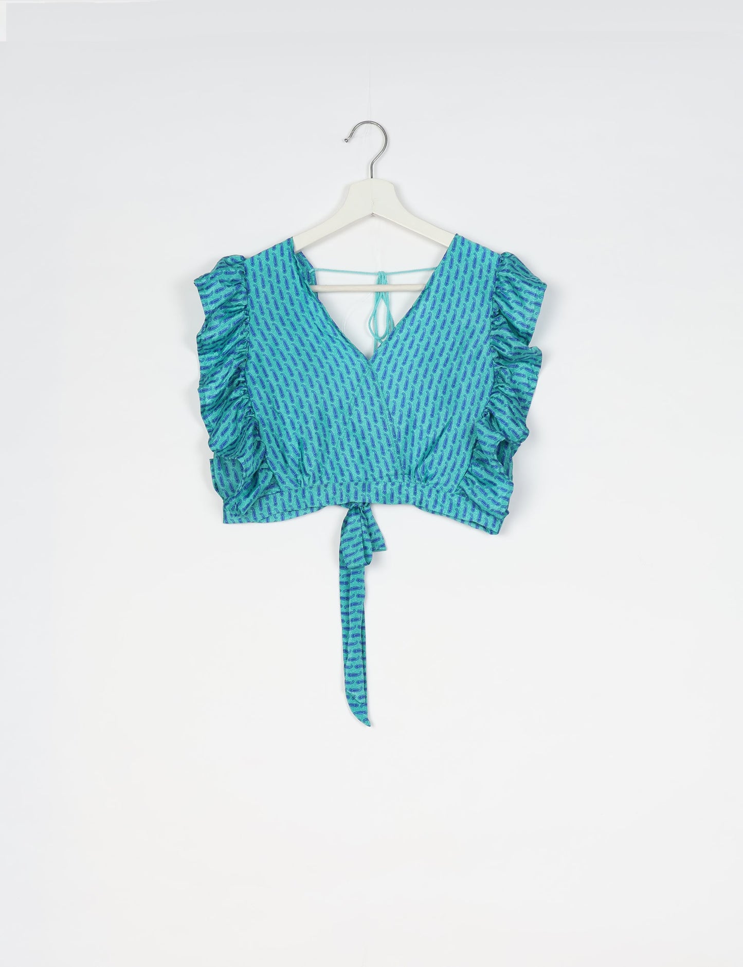 Frill Skirt Set made from recycled materials, highlighting sustainable fashion and fair trade practices. Features a ruffled wraparound skirt and a string-back top, symbolizing upcycled women's clothing and eco-friendly fashion.