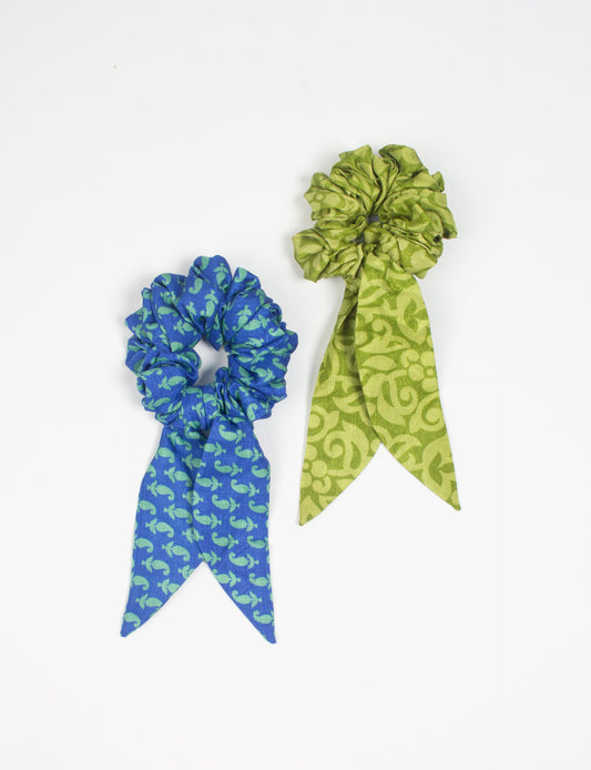 Colorful Tail Scrunchy made from sustainable, upcycled women's clothing. An eco-friendly fashion accessory promoting green fashion, recycled clothing, and ethical fashion choices.