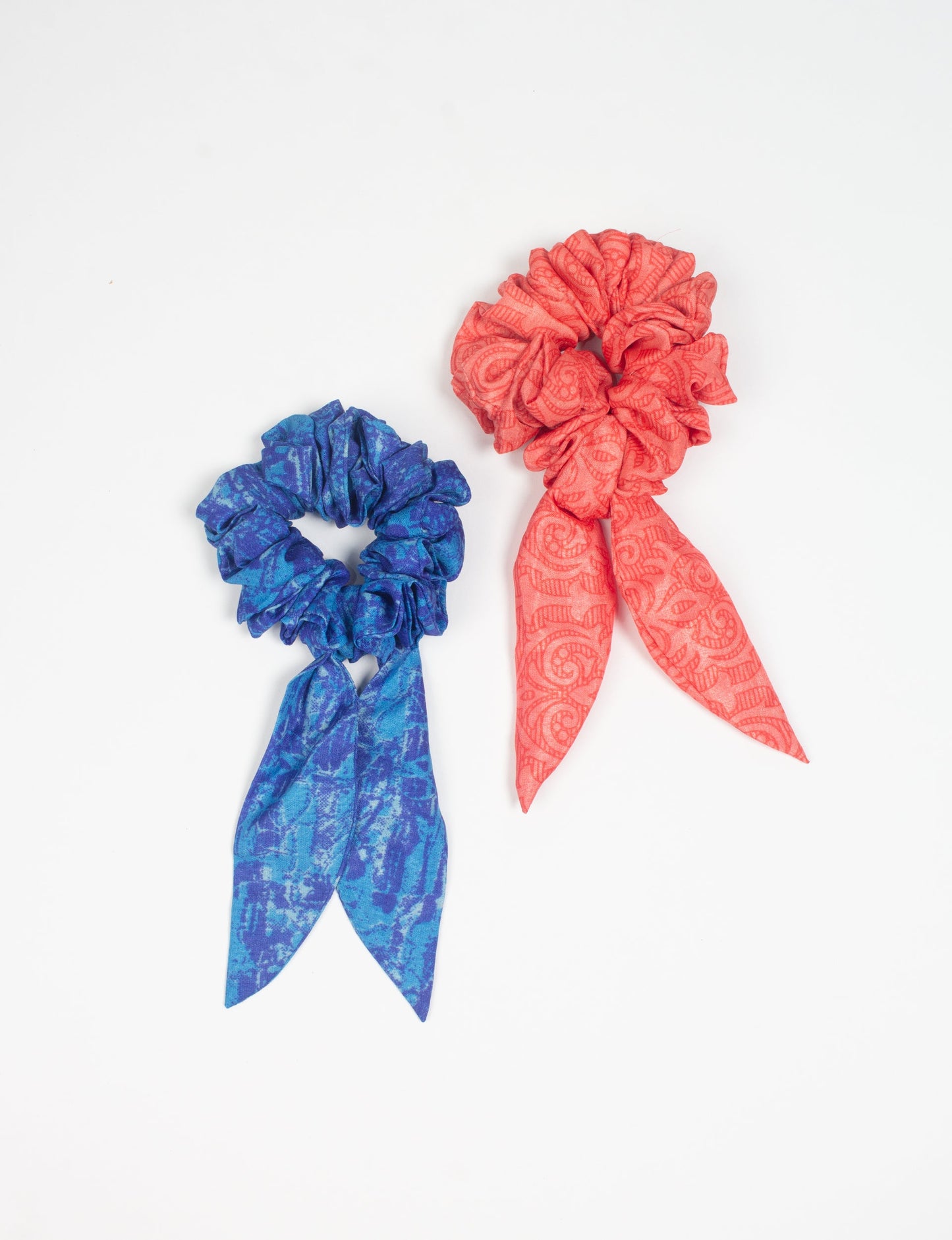 Colorful Tail Scrunchy made from sustainable, upcycled women's clothing. An eco-friendly fashion accessory promoting green fashion, recycled clothing, and ethical fashion choices.