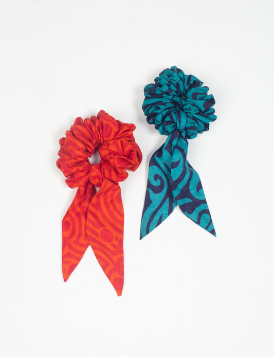 Colorful Tail Scrunchy made from sustainable, upcycled women's clothing. An eco-friendly fashion accessory promoting green fashion, recycled clothing, and ethical fashion choices.