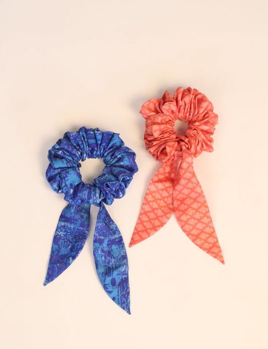 Colorful Tail Scrunchy made from sustainable, upcycled women's clothing. An eco-friendly fashion accessory promoting green fashion, recycled clothing, and ethical fashion choices.