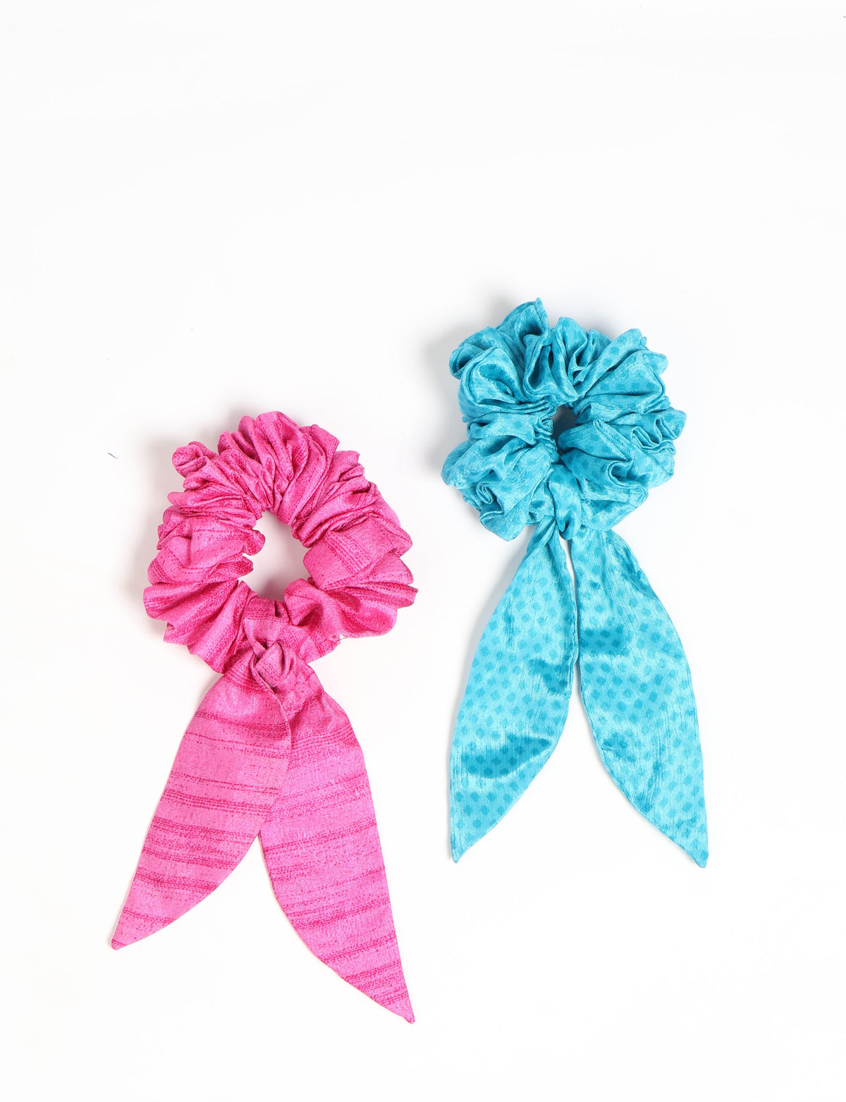 Colorful Tail Scrunchy made from sustainable, upcycled women's clothing. An eco-friendly fashion accessory promoting green fashion, recycled clothing, and ethical fashion choices.