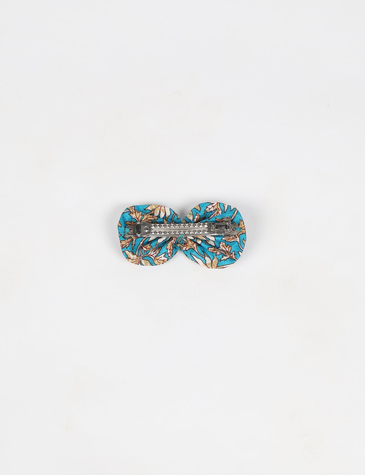 Stylish upcycled women's hairclip made from eco friendly products, reflecting the essence of upcycling fashion, ethical clothing, and sustainable apparel—ideal for those embracing slow fashion and earth friendly clothing.