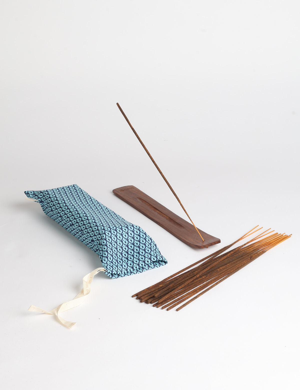 Incense stick set with wooden holder and repurposed sari fabric pouch, including 40 incense sticks.