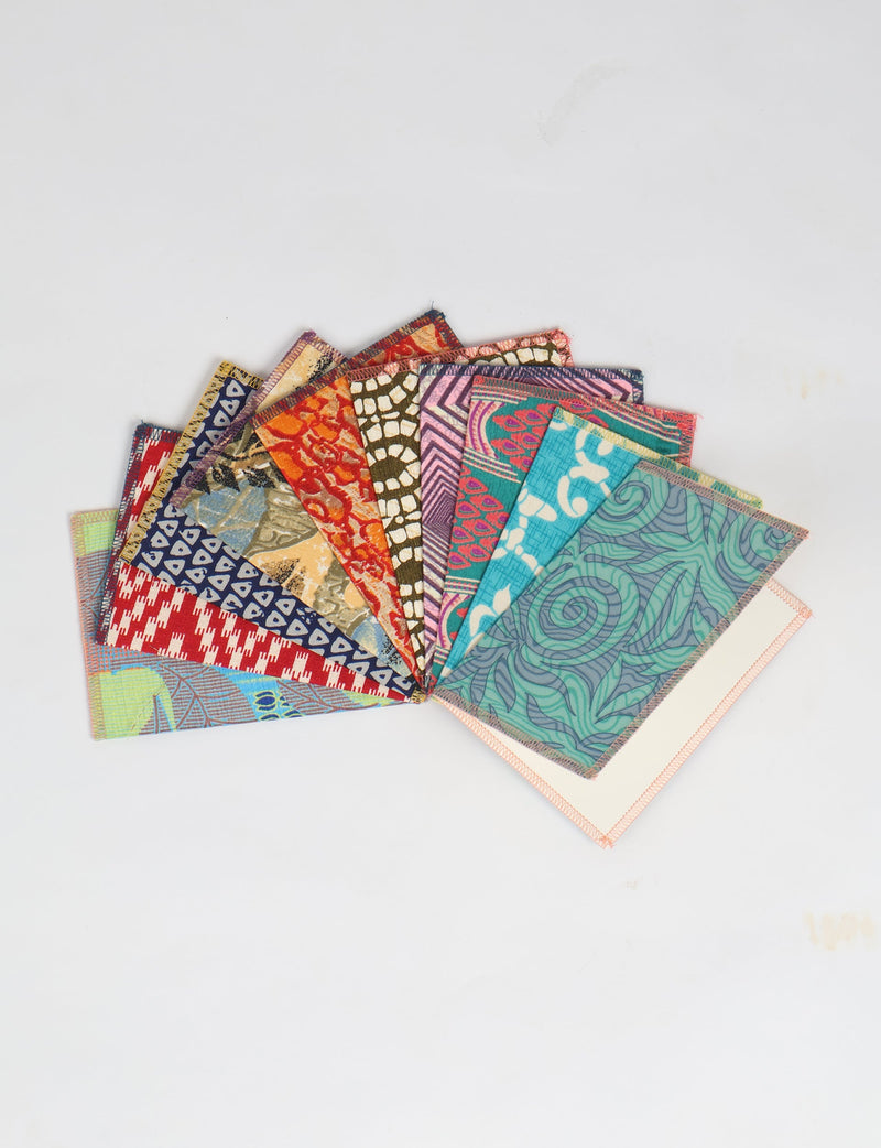 Folded postcard set of 10 pieces with colorful, patterned fabric covers, shown fanned out on a white background