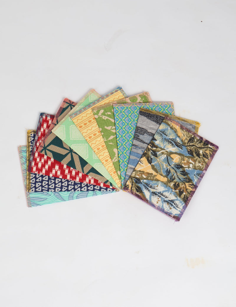 Set of 10 folded postcards with colorful geometric, floral, and abstract patterns, shown fanned out on white background