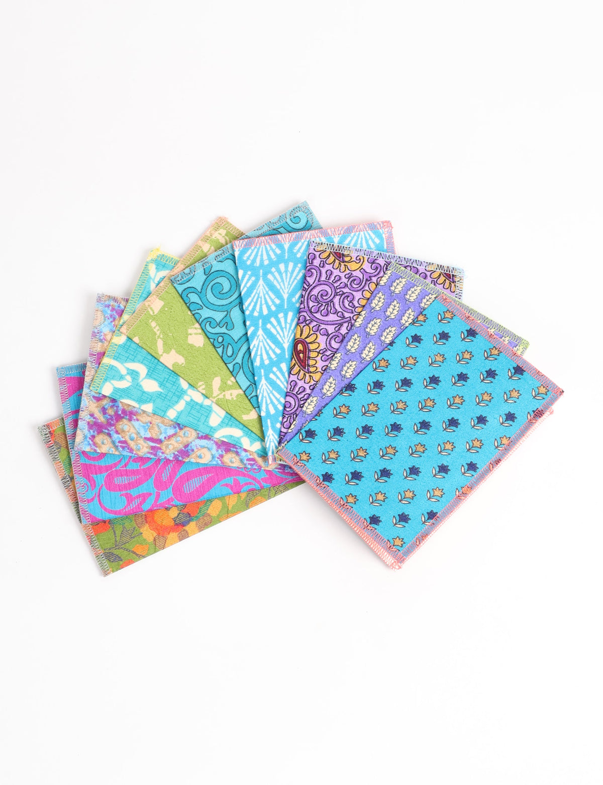 Set of ten folded postcards with colorful floral and geometric patterns, shown fanned out on a white background