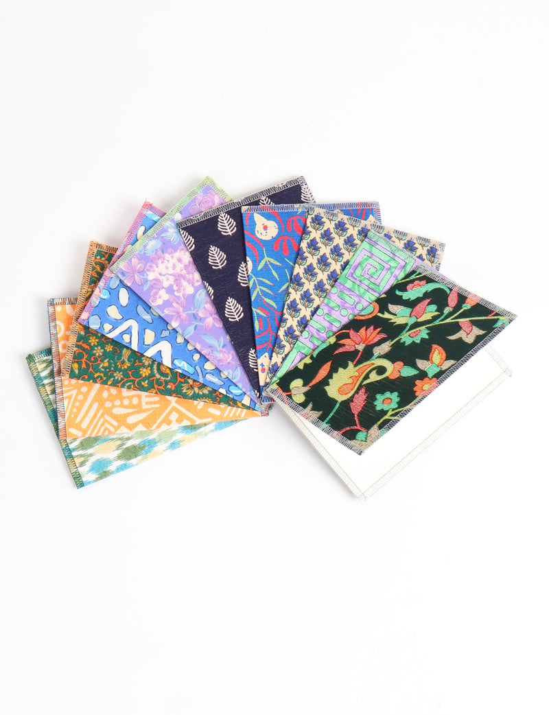 Set of ten folded postcards with colorful floral and geometric patterns, shown fanned out on a white background