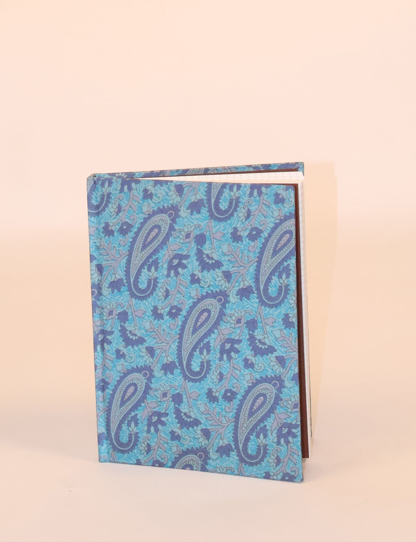 Elevate your scribbling experience with our A5 hardcover notebook, an epitome of green fashion. Sustainable and upcycled, this notebook features recycled fabric covers and aligns with the ethos of circular fashion. Dive into conscious living with our eco-friendly, recycled material notebook.