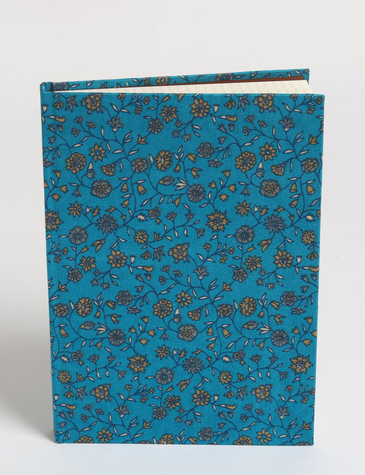 Elevate your scribbling experience with our A5 hardcover notebook, an epitome of green fashion. Sustainable and upcycled, this notebook features recycled fabric covers and aligns with the ethos of circular fashion. Dive into conscious living with our eco-friendly, recycled material notebook.