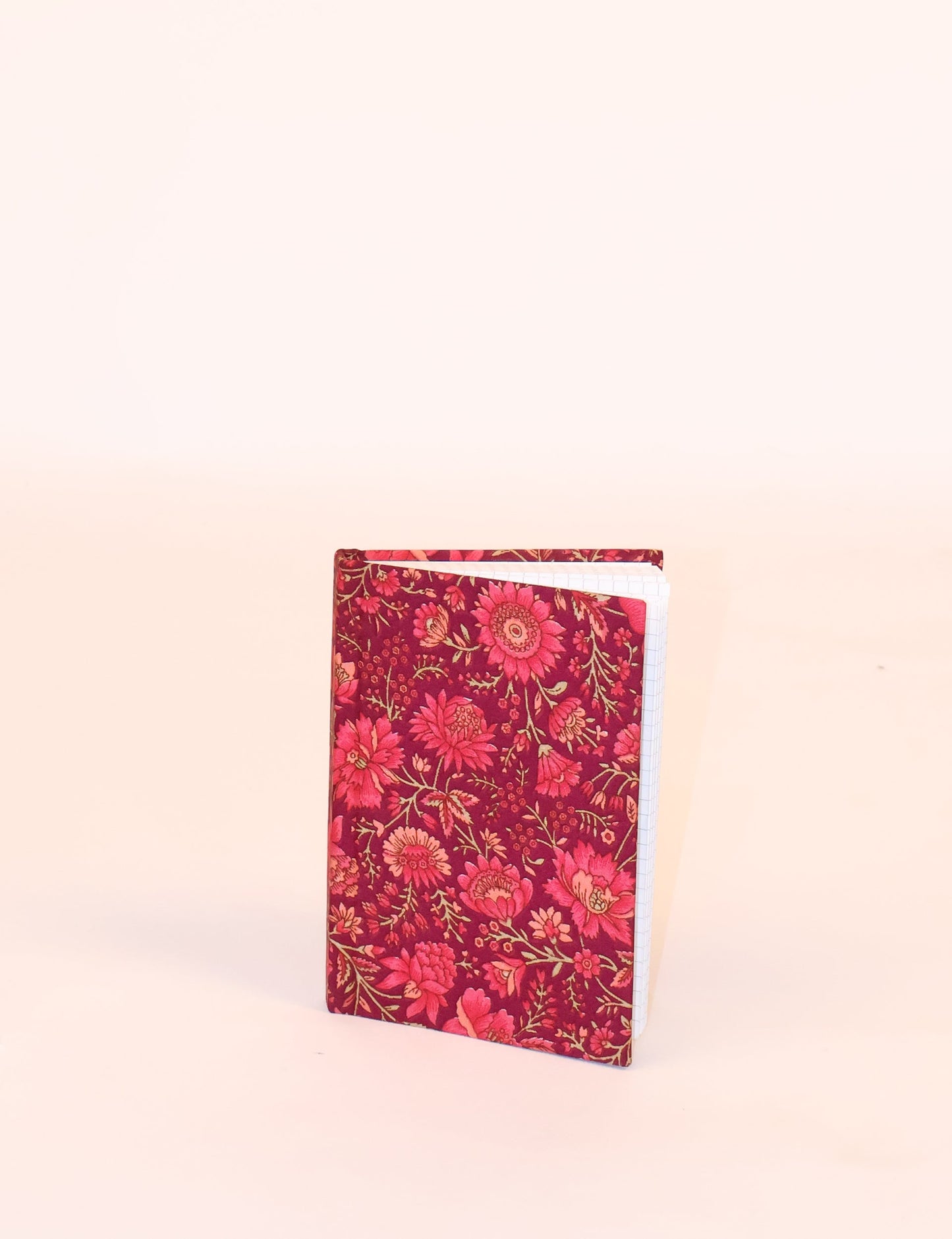 Indulge your creative spirit with our A6 hardcover notebook – a blend of sustainability and style. Made with 100% recycled paper and adorned with pre-loved sari fabric, this eco-conscious notebook encourages mindful note-taking and resonates with the principles of eco-friendly fashion.