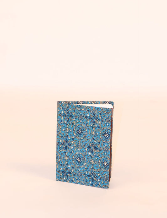 Indulge your creative spirit with our A6 hardcover notebook – a blend of sustainability and style. Made with 100% recycled paper and adorned with pre-loved sari fabric, this eco-conscious notebook encourages mindful note-taking and resonates with the principles of eco-friendly fashion.