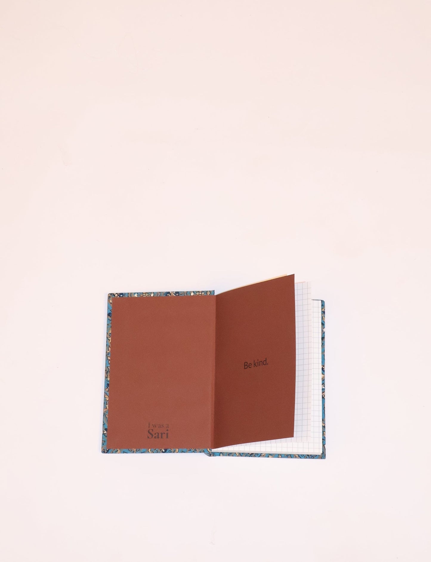 Indulge your creative spirit with our A6 hardcover notebook – a blend of sustainability and style. Made with 100% recycled paper and adorned with pre-loved sari fabric, this eco-conscious notebook encourages mindful note-taking and resonates with the principles of eco-friendly fashion.