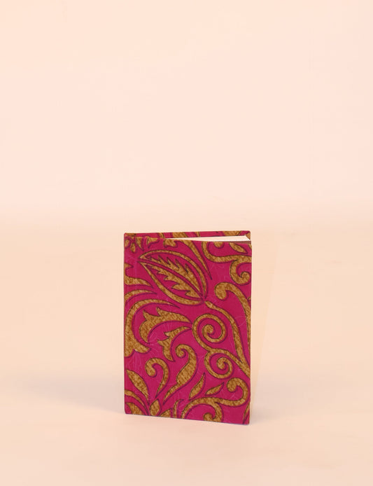 Indulge your creative spirit with our A6 hardcover notebook – a blend of sustainability and style. Made with 100% recycled paper and adorned with pre-loved sari fabric, this eco-conscious notebook encourages mindful note-taking and resonates with the principles of eco-friendly fashion.