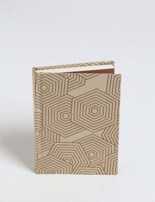Indulge your creative spirit with our A6 hardcover notebook – a blend of sustainability and style. Made with 100% recycled paper and adorned with pre-loved sari fabric, this eco-conscious notebook encourages mindful note-taking and resonates with the principles of eco-friendly fashion.