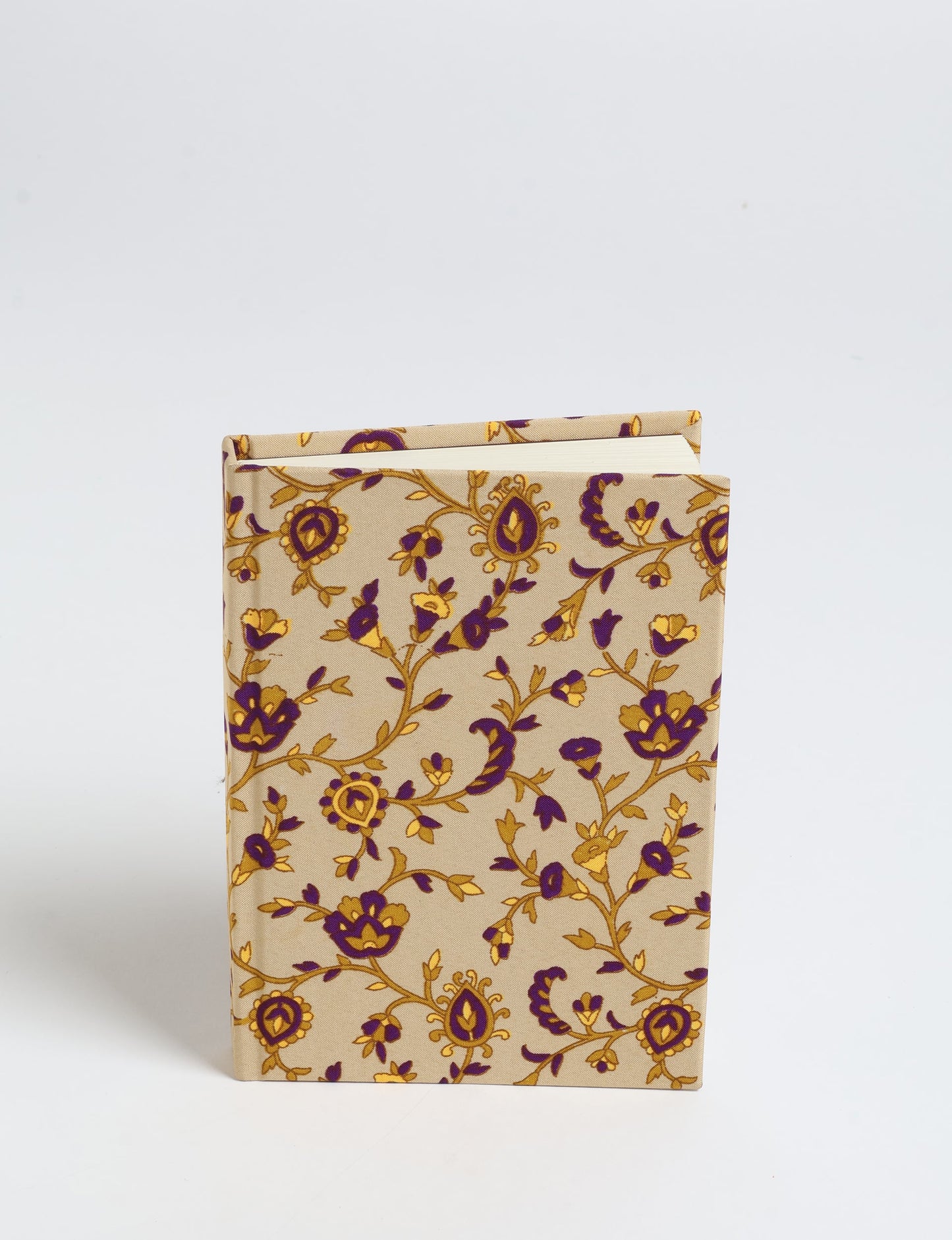 Indulge your creative spirit with our A6 hardcover notebook – a blend of sustainability and style. Made with 100% recycled paper and adorned with pre-loved sari fabric, this eco-conscious notebook encourages mindful note-taking and resonates with the principles of eco-friendly fashion.