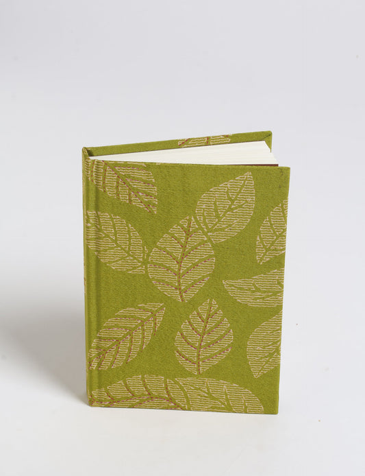 Indulge your creative spirit with our A6 hardcover notebook – a blend of sustainability and style. Made with 100% recycled paper and adorned with pre-loved sari fabric, this eco-conscious notebook encourages mindful note-taking and resonates with the principles of eco-friendly fashion.