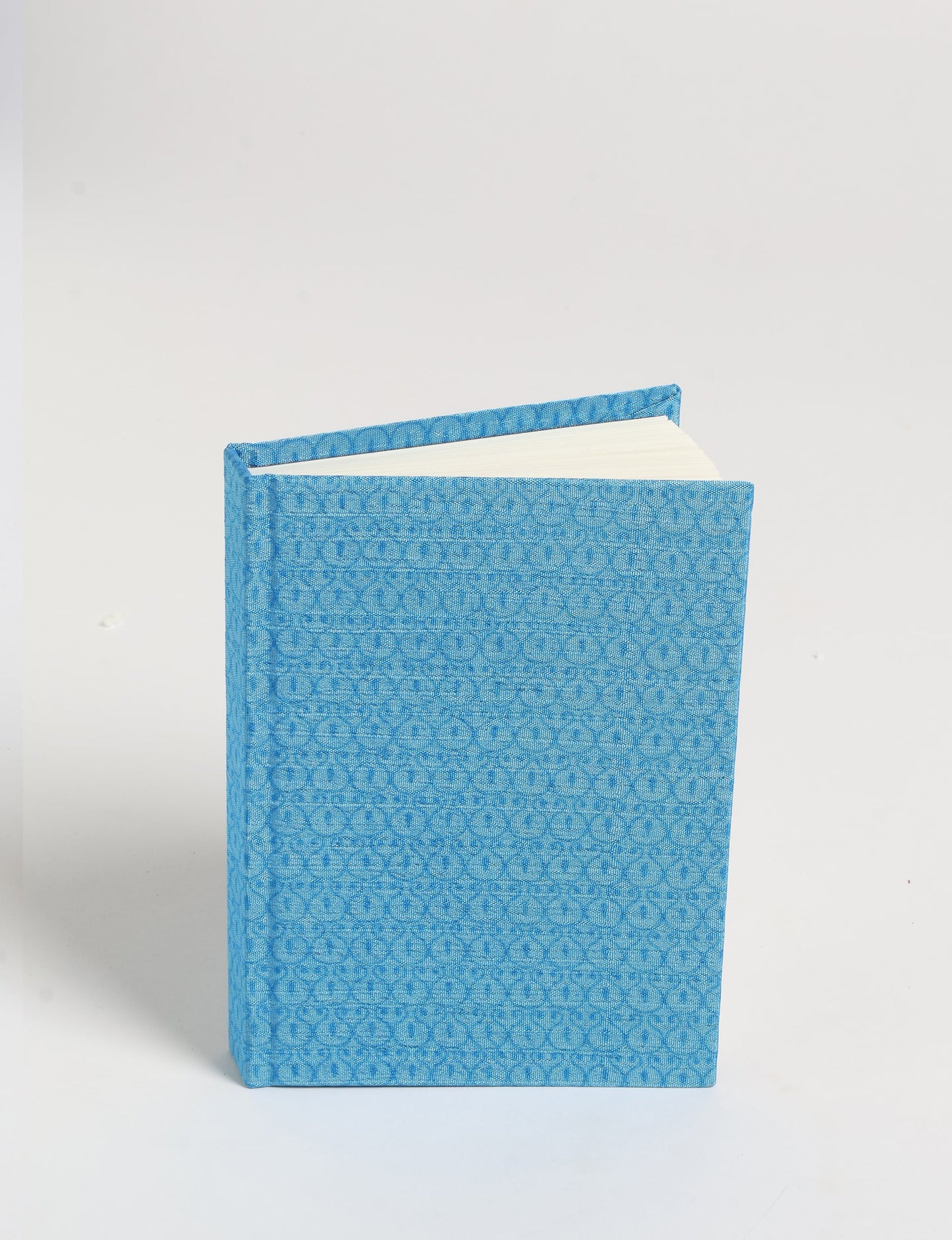 Indulge your creative spirit with our A6 hardcover notebook – a blend of sustainability and style. Made with 100% recycled paper and adorned with pre-loved sari fabric, this eco-conscious notebook encourages mindful note-taking and resonates with the principles of eco-friendly fashion.