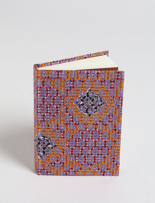 Indulge your creative spirit with our A6 hardcover notebook – a blend of sustainability and style. Made with 100% recycled paper and adorned with pre-loved sari fabric, this eco-conscious notebook encourages mindful note-taking and resonates with the principles of eco-friendly fashion.