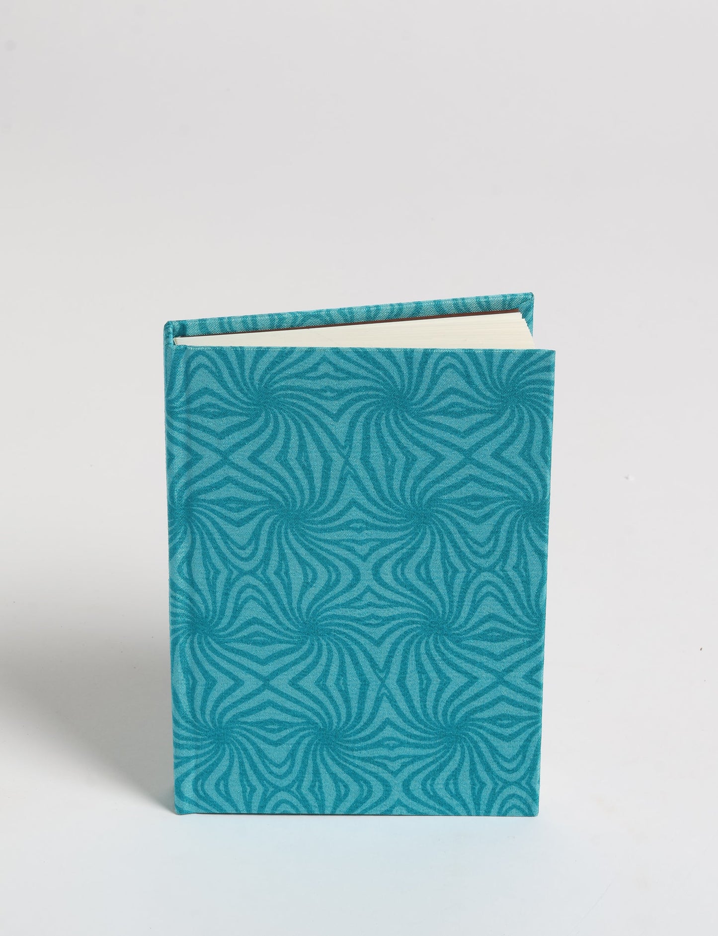 Indulge your creative spirit with our A6 hardcover notebook – a blend of sustainability and style. Made with 100% recycled paper and adorned with pre-loved sari fabric, this eco-conscious notebook encourages mindful note-taking and resonates with the principles of eco-friendly fashion.