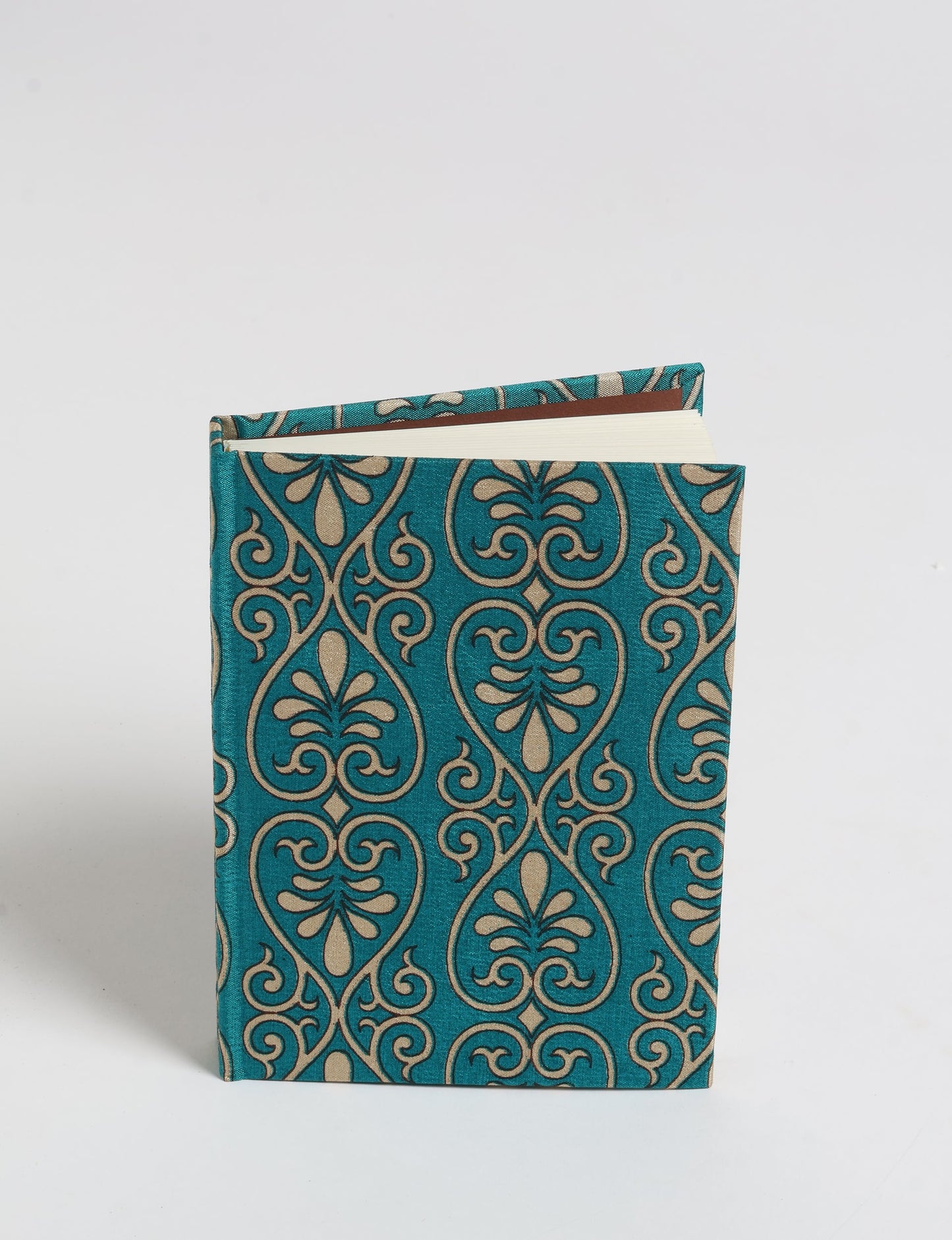 Indulge your creative spirit with our A6 hardcover notebook – a blend of sustainability and style. Made with 100% recycled paper and adorned with pre-loved sari fabric, this eco-conscious notebook encourages mindful note-taking and resonates with the principles of eco-friendly fashion.