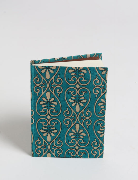 Indulge your creative spirit with our A6 hardcover notebook – a blend of sustainability and style. Made with 100% recycled paper and adorned with pre-loved sari fabric, this eco-conscious notebook encourages mindful note-taking and resonates with the principles of eco-friendly fashion.