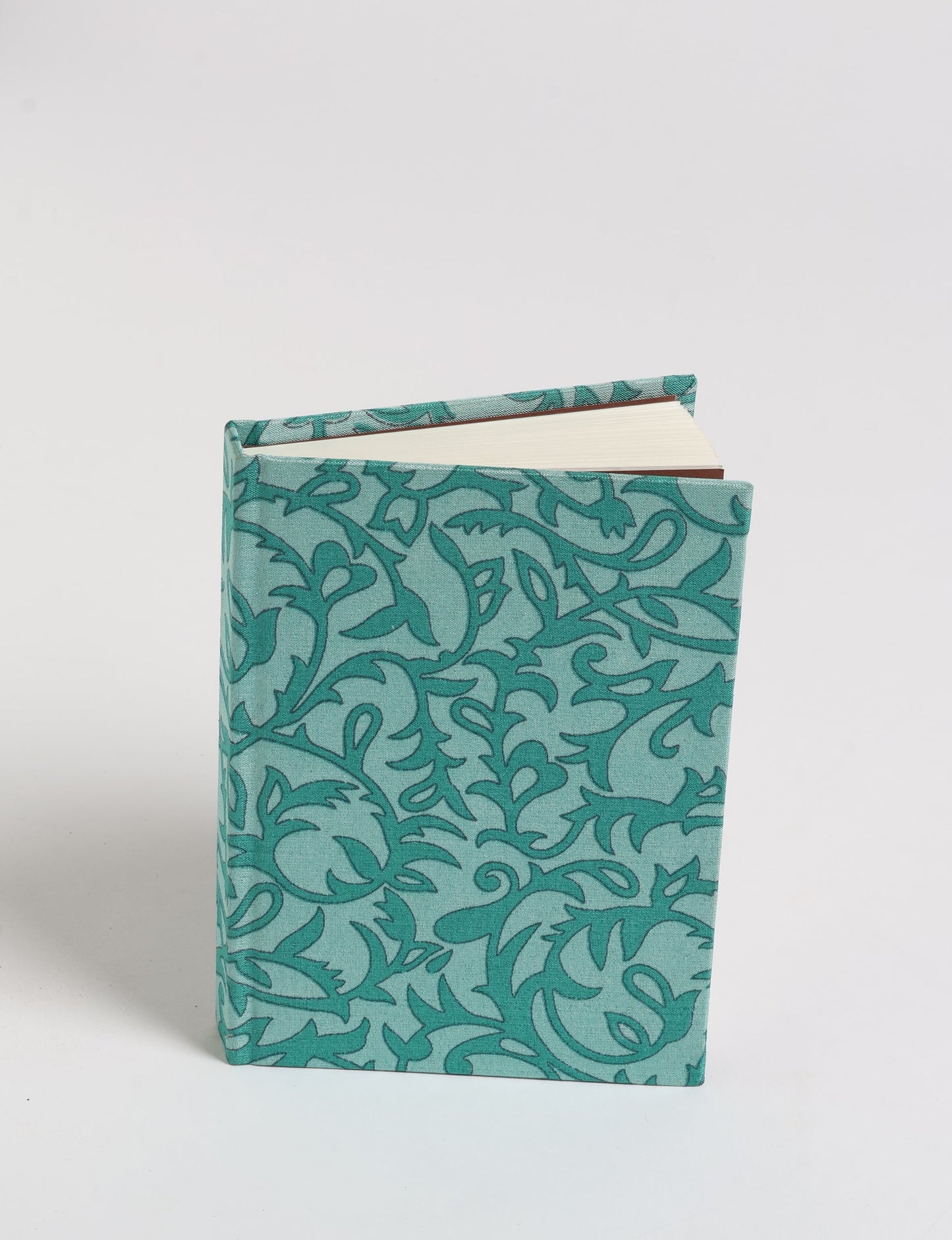 Indulge your creative spirit with our A6 hardcover notebook – a blend of sustainability and style. Made with 100% recycled paper and adorned with pre-loved sari fabric, this eco-conscious notebook encourages mindful note-taking and resonates with the principles of eco-friendly fashion.