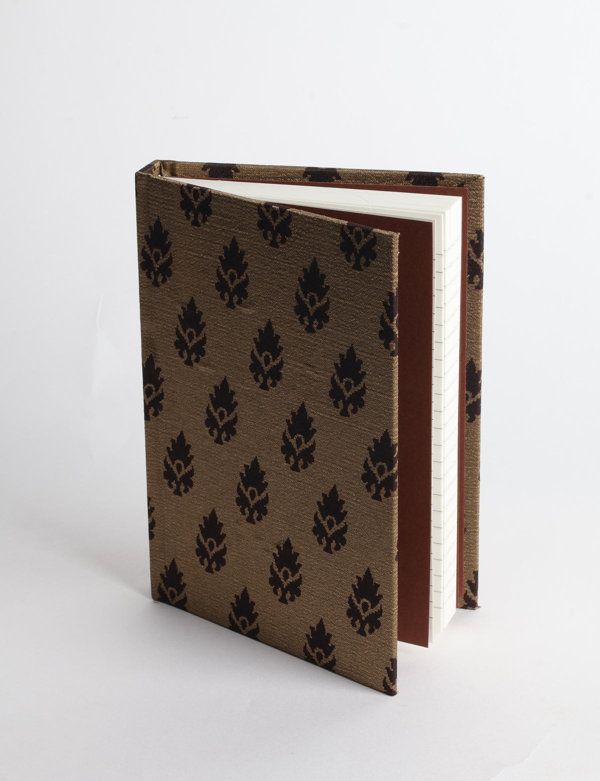 A6 hard cover notebook with teal pre-loved sari fabric cover featuring dark green floral vine pattern, standing upright