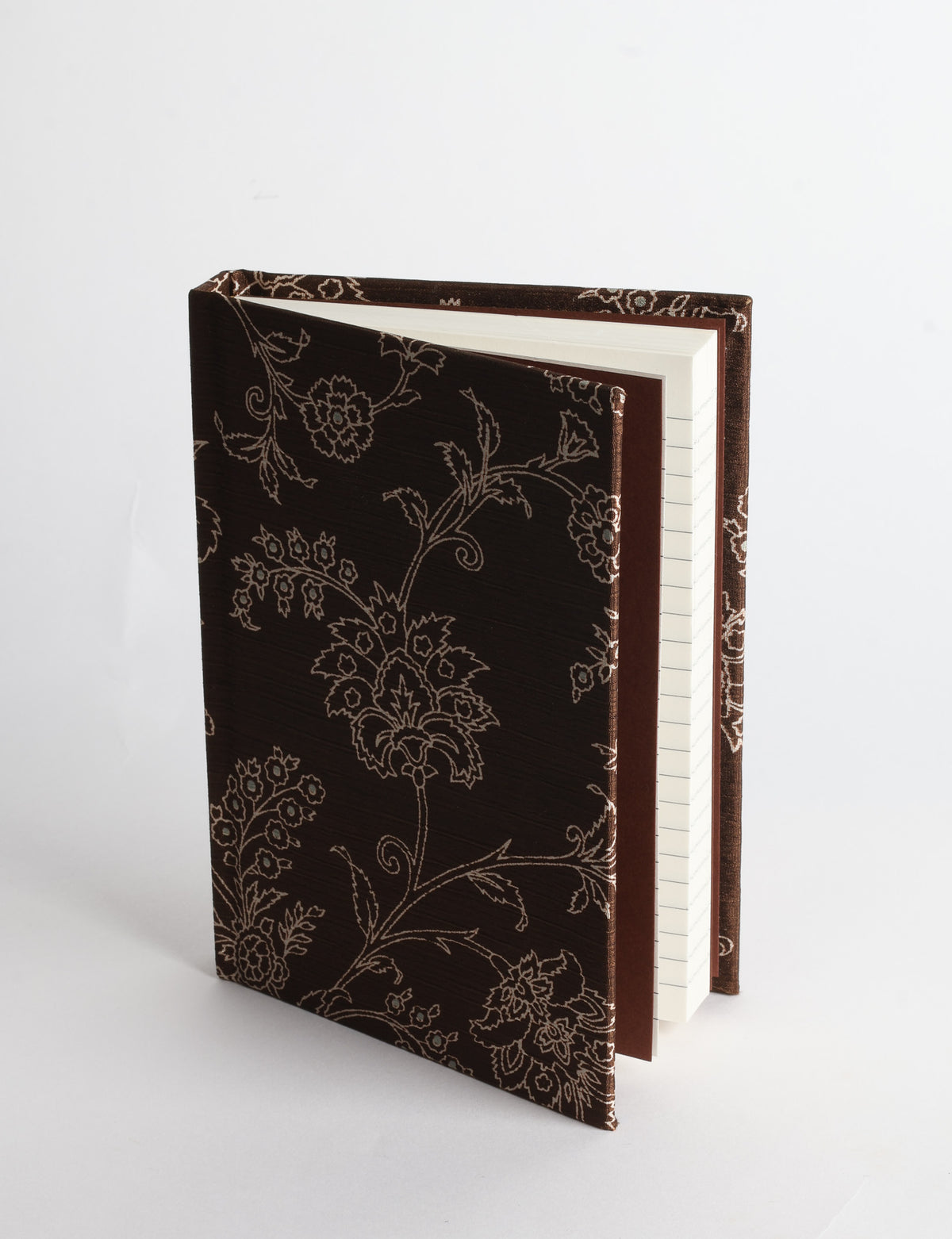 A6 hard cover notebook with teal pre-loved sari fabric cover featuring dark green floral vine pattern, standing upright