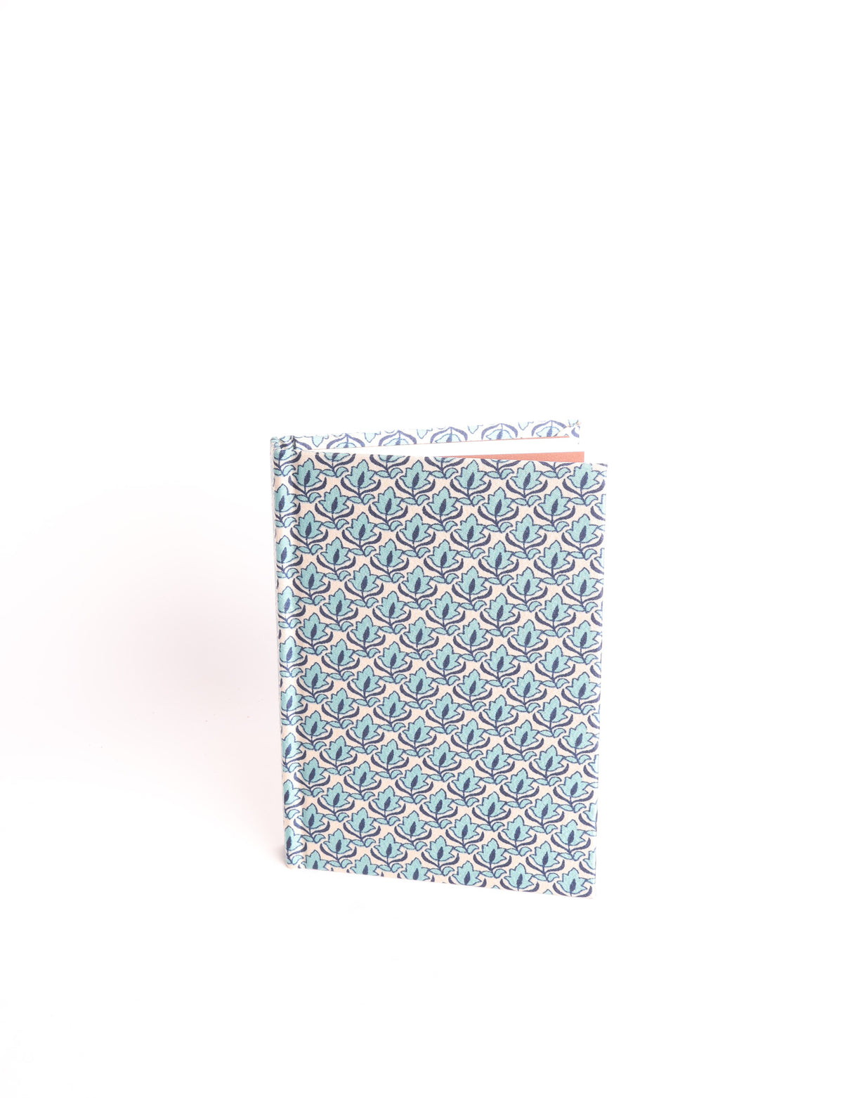 A6 hard cover notebook with teal pre-loved sari fabric cover featuring dark green floral vine pattern, standing upright