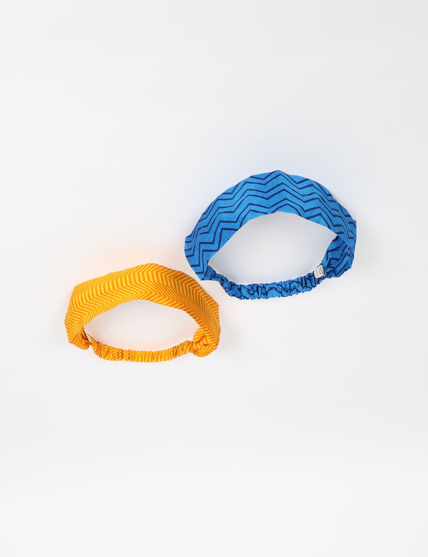 Upcycled sari elastic headband in colorful recycled fabric, handmade with zero waste clothing practices—an example of ethical clothing, fair trade fashion, and eco friendly fashion supporting climate neutral, sustainable women’s clothing.