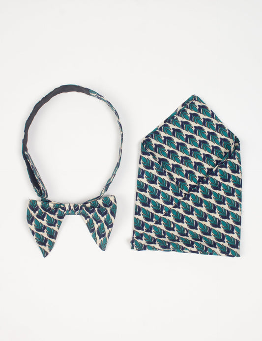 Dapper BOW TIE & POCKET SQUARE SET, ethically handcrafted with lively prints and eye-catching colors. Made by Mumbai-based craftswomen, this ensemble adds excitement to classic formal-wear. Sustainable fashion supporting fair trade, slow fashion, and empowering women artisans. A powerful story of transformation.